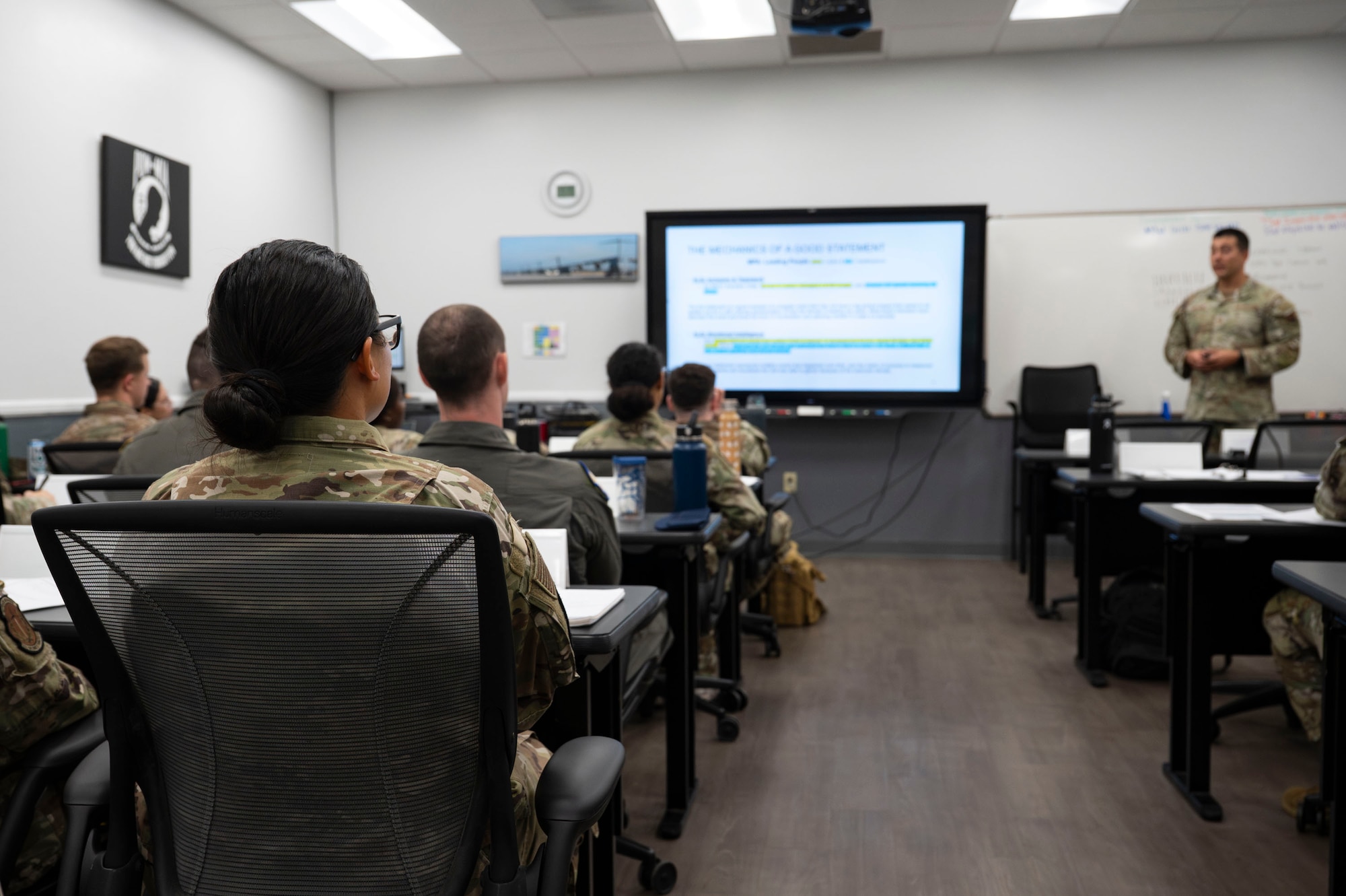 U.S. Air Force Airmen listen to a briefing during the Junior Enlisted Foundations 300 Course at Davis-Monthan Air Force Base, Arizona, Sept. 3, 2025. The course equips Airmen with tools and knowledge to strengthen their readiness and prepare them for future responsibilities in their Air Force careers. (U.S. Air Force photo by Airman 1st Class Samantha Melecio)