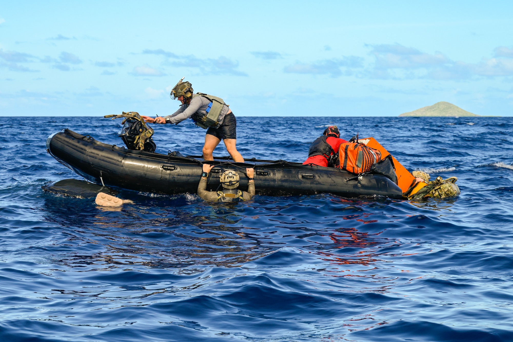 U.S. Air Force special tactics Airmen from the Kentucky Air National Guard’s 123rd Airlift Wing load gear into an inflatable boat for a search-and-rescue mission after parachuting into the Caribbean Sea off the coast of St. Croix, U.S. Virgin Islands, Aug. 29, 2025 as part of Emerald Warrior 25.2, a large-scale special operations exercise staged in multiple locations by Air Force Special Operations Command. St. Croix provides an ideal environment for testing littoral and maritime capabilities, simulating many of the geographic features that special operators may encounter when deployed around the world to project air power in unfamiliar or contested environments. (U.S. Air National Guard photo by Dale Greer)
