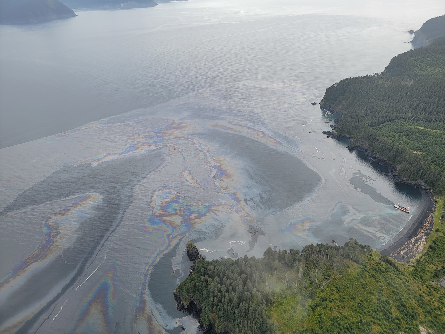 An aircrew from Coast Guard Air Station Kodiak conducts an overflight of a fishing vessel that ran aground in Izhut Bay, Kodiak, Alaska, Sept. 1, 2025. The Coast Guard is responding to the diesel released from the vessel. (U.S. Coast Guard courtesy photo)