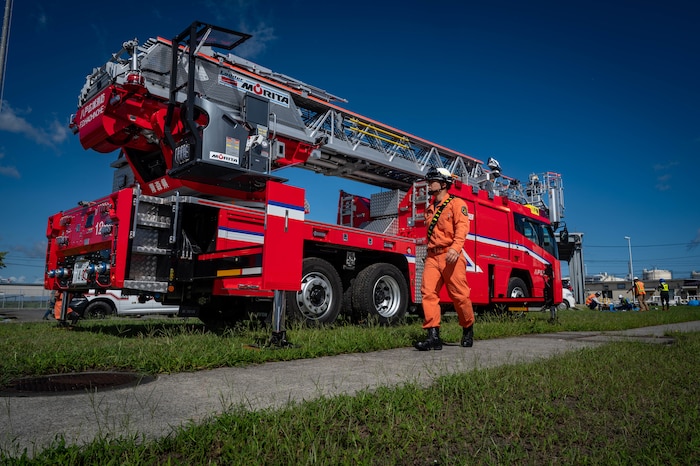 A Hachinohe City Fire Department firefighter inspects a fire engine prior to conducting a fuel tank fire drill alongside U.S. Air Force firefighters assigned to the 35th Civil Engineer Squadron at Hachinohe City, Japan, Sept. 3, 2025.