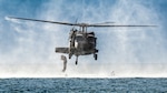 U.S. Air Force special tactics Airmen from the Kentucky Air National Guard’s 123rd Airlift Wing conduct infil operations into the Caribbean Sea from a Mississippi Army National Guard UH-60 Black Hawk off the coast of St. Croix, U.S. Virgin Islands, Aug. 28, 2025 as part of Emerald Warrior 25.2, a large-scale special operations exercise staged in multiple locations by Air Force Special Operations Command. St. Croix provides an ideal environment for testing littoral and maritime capabilities, simulating many of the geographic features that special operators may encounter when deployed around the world to project air power in unfamiliar or contested environments. (U.S. Air National Guard photo by Dale Greer)
