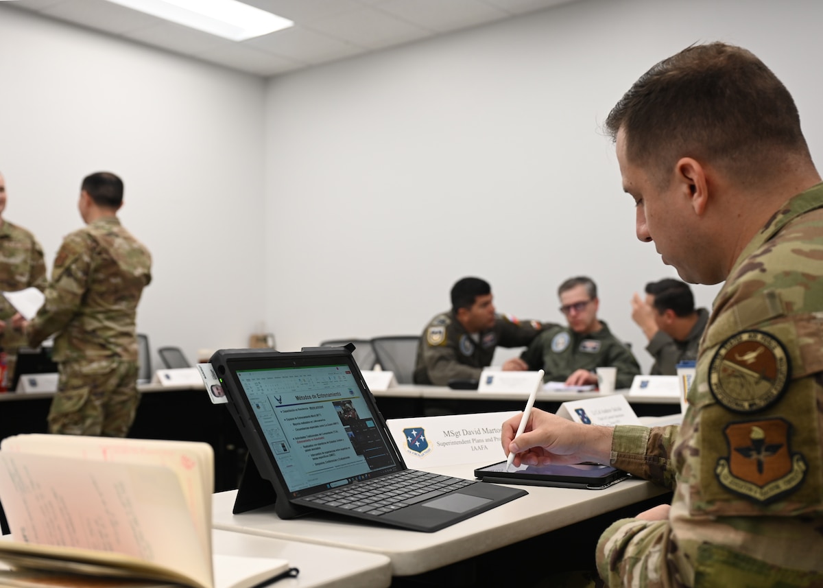 U.S. Air Force Master Sgt. David Martos, 387th Training Squadron resource management flight chief, takes notes during Chilean Air Force (FACh) Airman-to-Airman Talks at Davis-Monthan Air Force Base, Arizona, Aug. 27, 2025. The A2A Talks were hosted by Air Forces Southern are were designed to strengthen security cooperation, enhance interoperability, and build enduring partnerships with the FACh through joint training, subject matter exchanges, and collaborative engagements that support regional stability and mutual defense interests. (U.S. Air Force photo by Staff Sgt. Abbey Rieves)