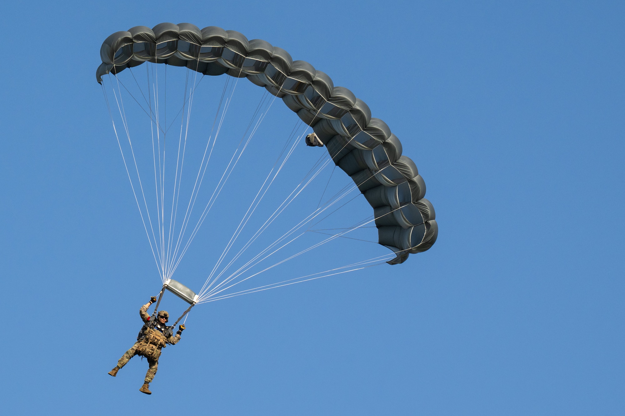 U.S. Air Force special tactics Airmen from the Kentucky Air National Guard’s 123rd Airlift Wing parachute into Henry E. Rohlsen Airport near Christiansted in St. Croix, U.S. Virgin Islands, Aug. 26, 2025 as part of Emerald Warrior 25.2, a large-scale special operations exercise being staged in multiple locations by Air Force Special Operations Command. The Airmen, joined by nine other combat controllers and pararescuemen, took control of the airfield to receive follow-on aircraft in support of simulated combat and contingency operations. (U.S. Air National Guard photo by Dale Greer)