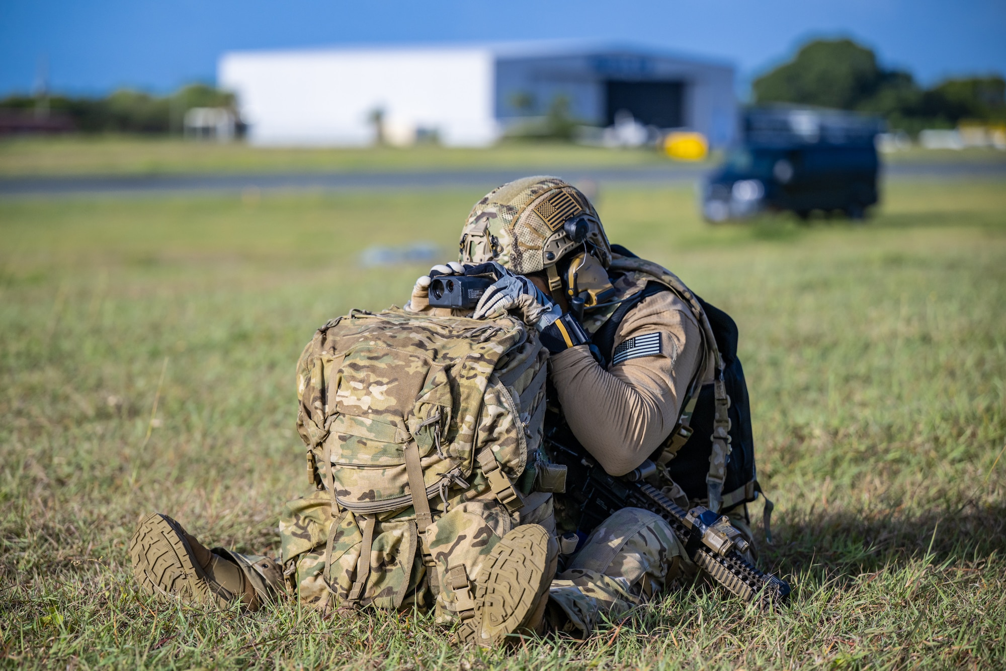 A U.S. Air Force special tactics Airman from the Kentucky Air National Guard’s 123rd Airlift Wing measures the guide slope of the runway at Henry E. Rohlsen Airport near Christiansted in St. Croix, U.S. Virgin Islands, Aug. 26, 2025 as part of Emerald Warrior 25.2, a large-scale special operations exercise being staged in multiple locations by Air Force Special Operations Command. The Airman is among a group of combat controllers and pararescuemen who parachuted into the airfield minutes earlier from a Kentucky Air Guard C-130J Super Hercules. (U.S. Air National Guard photo by Dale Greer)