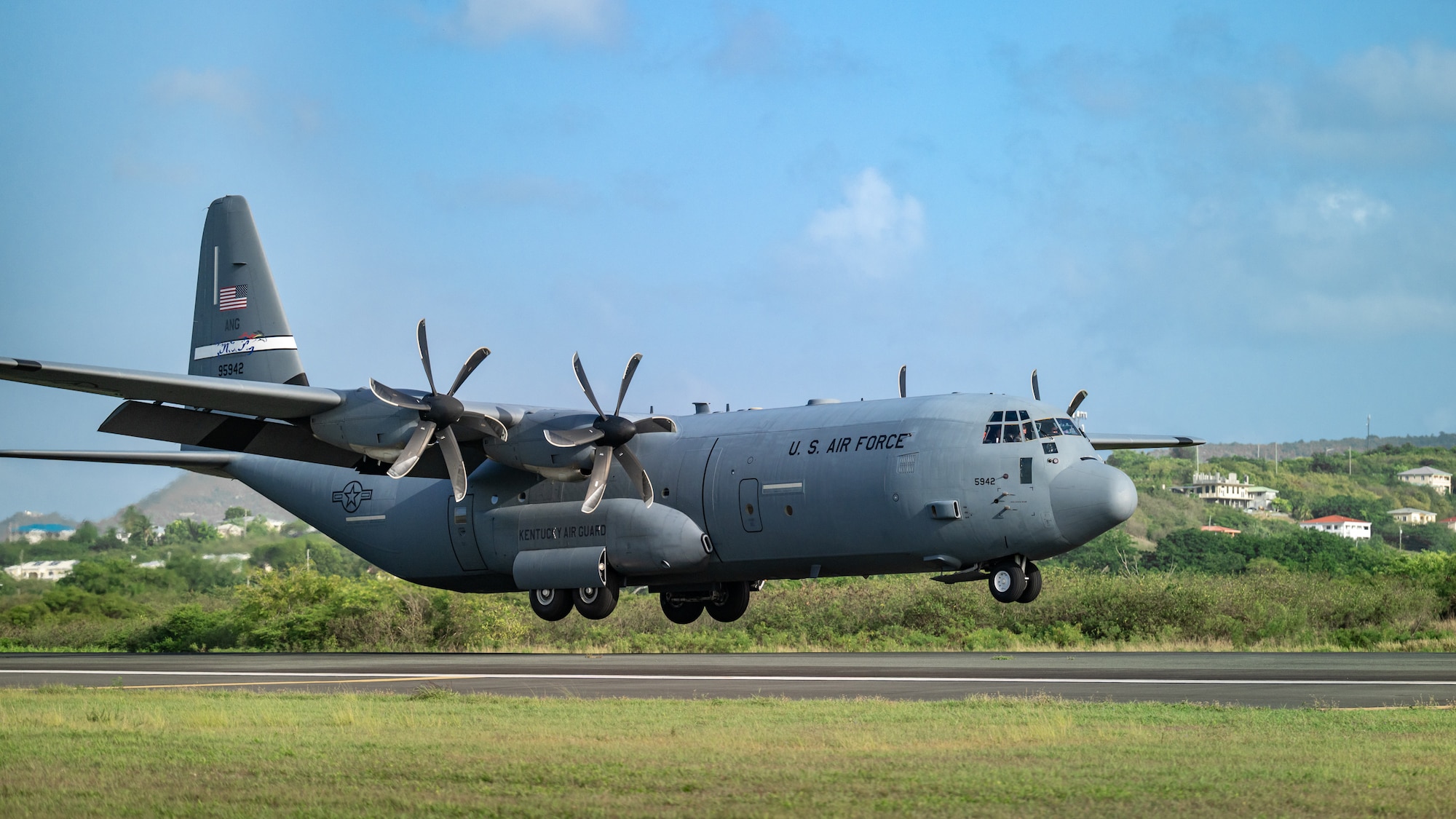 A C-130J Super Hercules aircraft from the Kentucky Air National Guard’s 123rd Airlift Wing lands at Henry E. Rohlsen Airport near Christiansted in St. Croix, U.S. Virgin Islands, Aug. 26, 2025 as part of Emerald Warrior 25.2, a large-scale special operations exercise being staged in multiple locations by Air Force Special Operations Command. The C-130 landed under air traffic control provided by special tactics Airmen from the 123rd, who parachuted into the airfield minutes earlier from the same aircraft. (U.S. Air National Guard photo by Dale Greer)