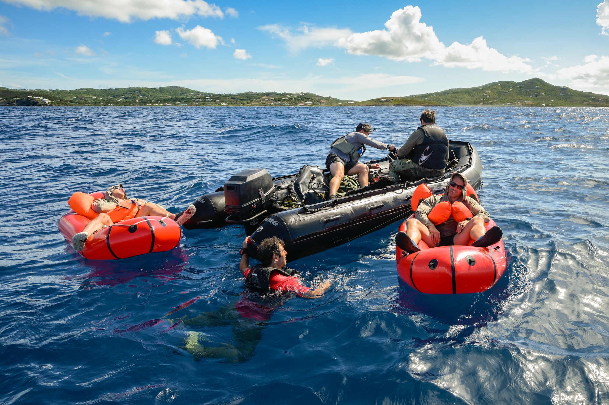 U.S. Air Force special tactics Airmen from the Kentucky Air National Guard’s 123rd Airlift Wing conduct medical assessments on two survivors of a simulated plane crash in the Caribbean Sea off the coast of St. Croix, U.S. Virgin Islands, Aug. 29, 2025 as part of Emerald Warrior 25.2, a large-scale special operations exercise staged in multiple locations by Air Force Special Operations Command. St. Croix provides an ideal environment for testing littoral and maritime capabilities, simulating many of the geographic features that special operators may encounter when deployed around the world to project air power in unfamiliar or contested environments. (U.S. Air National Guard photo by Dale Greer)
