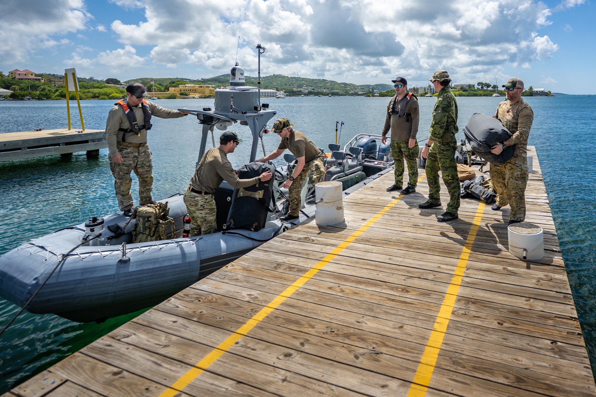 U.S. Air Force special tactics Airmen from the Kentucky Air National Guard’s 123rd Airlift Wing board a boat in Christiansted Harbor, U.S. Virgin Islands, to conduct a reconnaissance mission on another island 75 nautical miles away Aug. 27, 2025 as part of Emerald Warrior 25.2, a large-scale special operations exercise staged in multiple locations by Air Force Special Operations Command. The Caribbean provides an ideal environment for testing the unit’s littoral and maritime capabilities, simulating many of the geographic features that special operators may encounter when deployed around the world to project air power in unfamiliar or contested environments. (U.S. Air National Guard photo by Dale Greer)