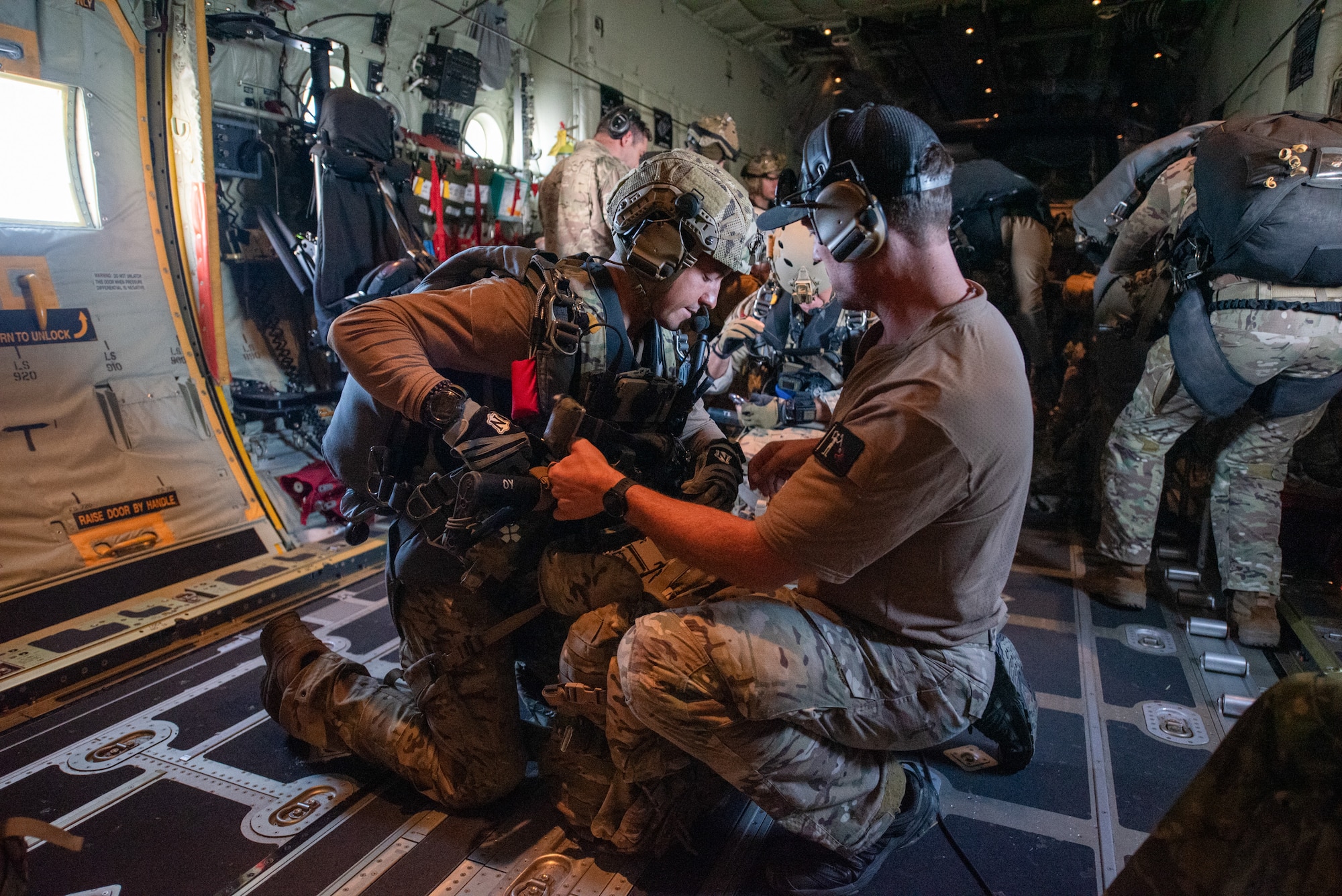 A U.S. Air Force special tactics Airman from the Kentucky Air National Guard’s 123rd Airlift Wing prepares to a jump from a Kentucky Air Guard C-130J Super Hercules into Henry E. Rohlsen Airport near Christiansted in St. Croix, U.S. Virgin Islands, Aug. 26, 2025 as part of Emerald Warrior 25.2, a large-scale special operations exercise being staged in multiple locations by Air Force Special Operations Command. The Airman, joined by 10 other combat controllers and pararescuemen, took control of the airfield to receive follow-on aircraft in support of simulated combat and contingency operations. (U.S. Air National Guard photo by Phil Speck)
