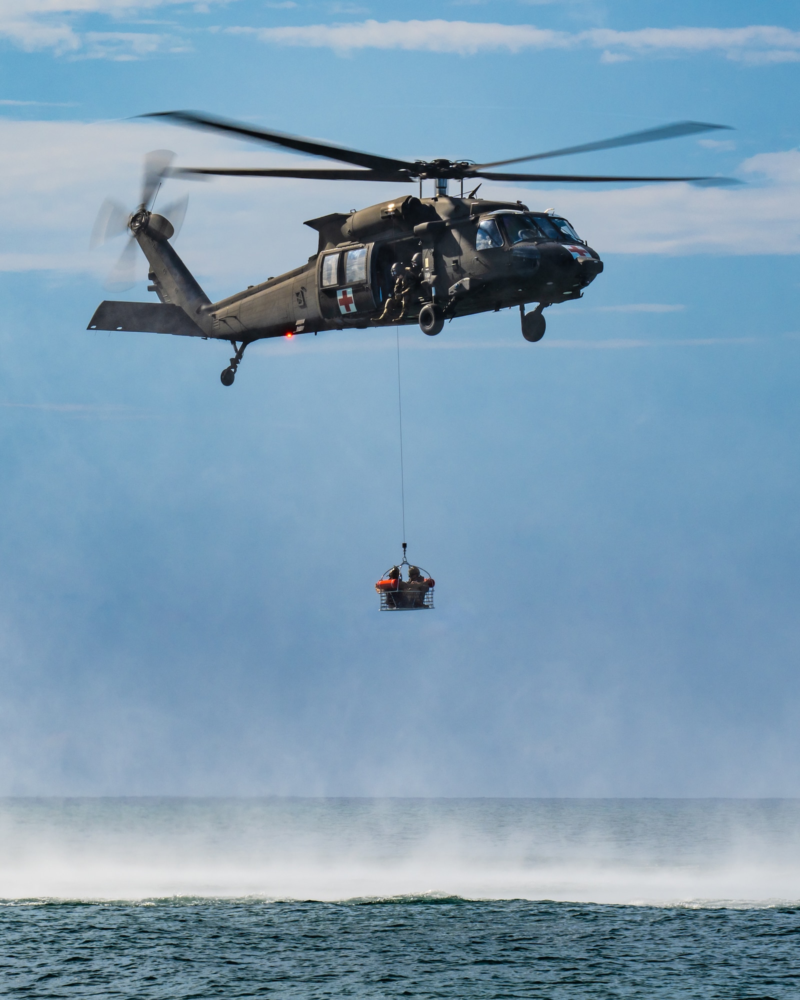 U.S. Air Force special tactics Airmen assigned to the Kentucky Air National Guard’s 123rd Airlift Wing conduct search-and-rescue hoist operations in the Caribbean Sea from a Mississippi Army National Guard UH-60 Black Hawk off the coast of St. Croix, U.S. Virgin Islands, Aug. 28, 2025 as part of Emerald Warrior 25.2, a large-scale special operations exercise staged in multiple locations by Air Force Special Operations Command. St. Croix provides an ideal environment for testing littoral and maritime capabilities, simulating many of the geographic features that special operators may encounter when deployed around the world to project air power in unfamiliar or contested environments. (U.S. Air National Guard photo by Dale Greer)