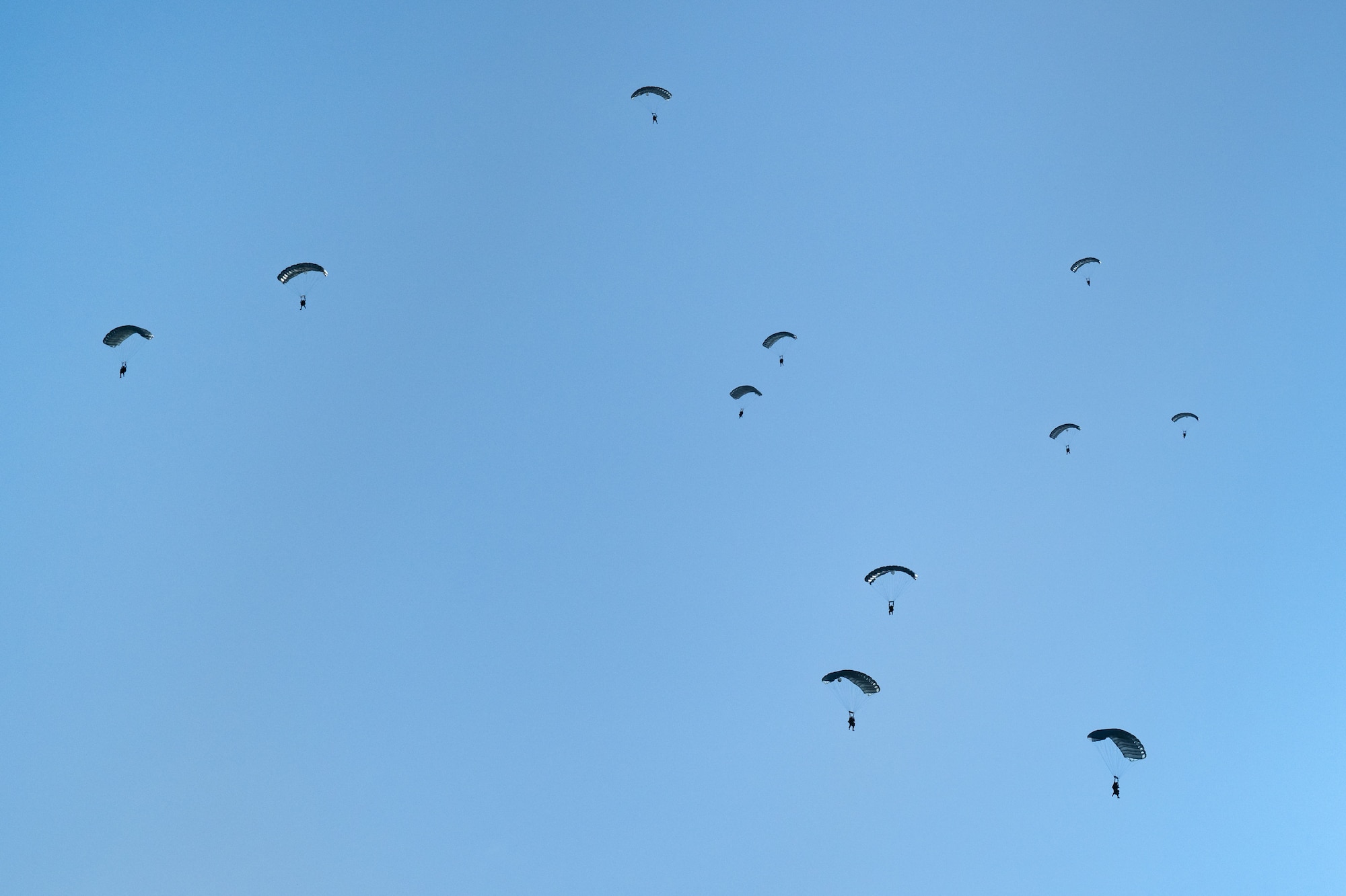 U.S. Air Force pararescuemen and combat controllers from the Kentucky Air National Guard’s 123rd Airlift Wing jump into Henry E. Rohlsen Airport near Christiansted in St. Croix, U.S. Virgin Islands, Aug. 26, 2025 as part of Emerald Warrior 25.2, a large-scale special operations exercise being staged in multiple locations by Air Force Special Operations Command. The special tactics Airmen took control of the airfield to receive follow-on aircraft in support of simulated combat and contingency operations. (U.S. Air National Guard photo by Dale Greer)