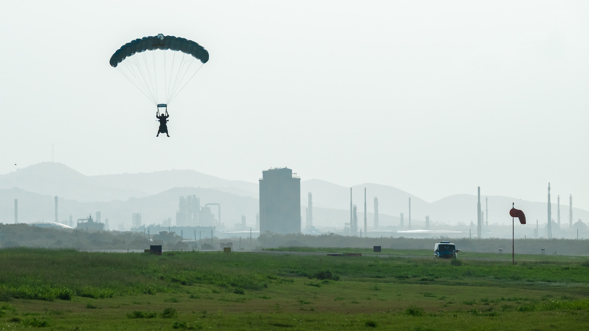 A U.S. Air Force special tactics Airman from the Kentucky Air National Guard’s 123rd Airlift Wing parachutes into Henry E. Rohlsen Airport near Christiansted in St. Croix, U.S. Virgin Islands, Aug. 26, 2025 as part of Emerald Warrior 25.2, a large-scale special operations exercise being staged in multiple locations by Air Force Special Operations Command. The Airman, joined by 10 other combat controllers and pararescuemen, took control of the airfield to receive follow-on aircraft in support of simulated combat and contingency operations. (U.S. Air National Guard photo by Dale Greer)