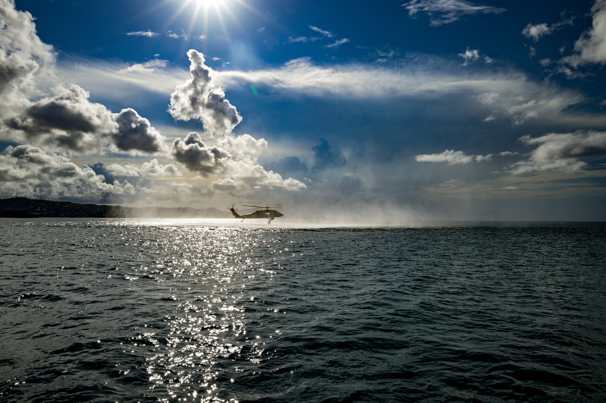 U.S. Air Force special tactics Airmen from the Kentucky Air National Guard’s 123rd Airlift Wing conduct exfil operations from the Caribbean Sea into a Mississippi Army National Guard UH-60 Black Hawk off the coast of St. Croix, U.S. Virgin Islands, Aug. 28, 2025 as part of Emerald Warrior 25.2, a large-scale special operations exercise staged in multiple locations by Air Force Special Operations Command. St. Croix provides an ideal environment for testing littoral and maritime capabilities, simulating many of the geographic features that special operators may encounter when deployed around the world to project air power in unfamiliar or contested environments. (U.S. Air National Guard photo by Dale Greer)