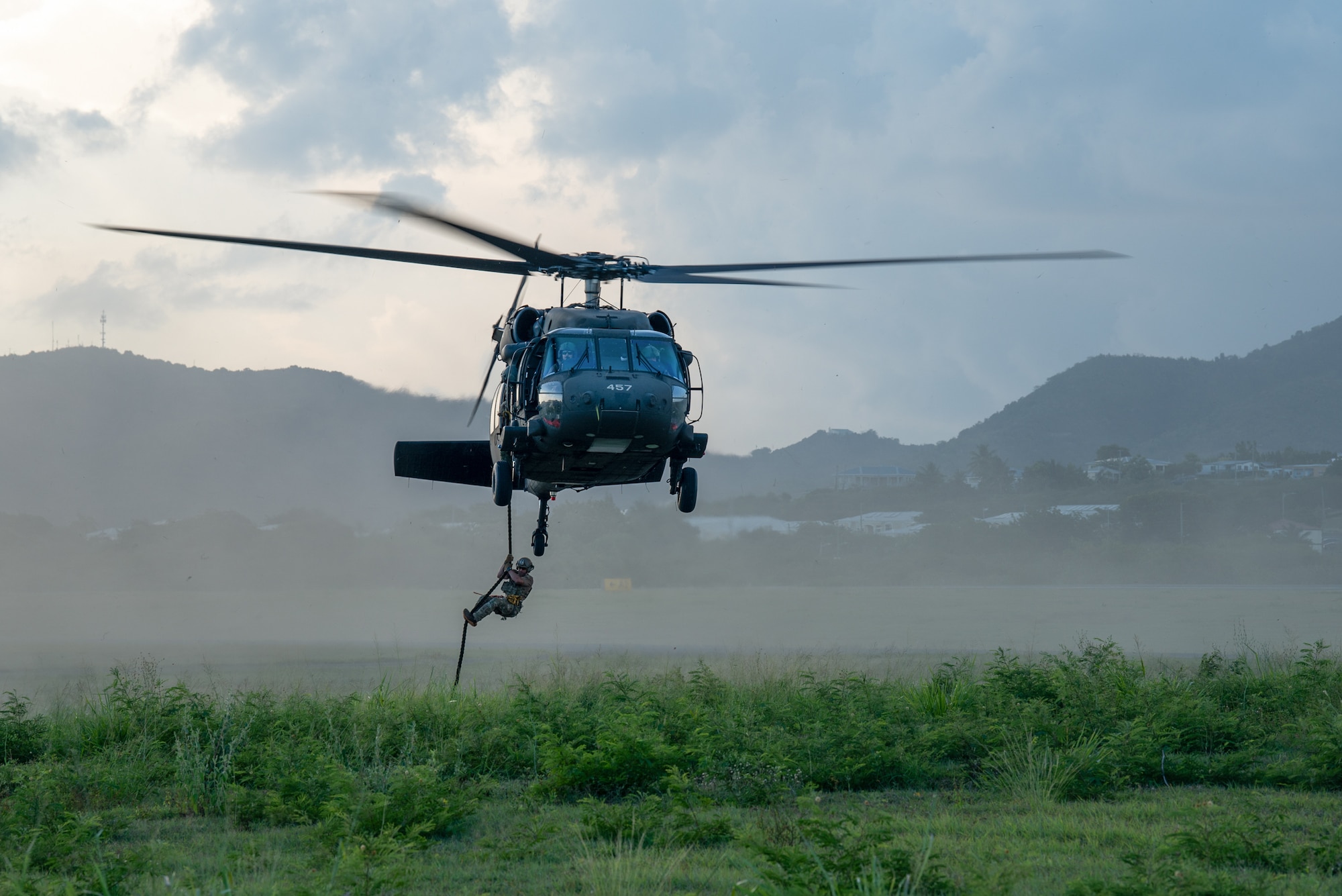 A U.S. Air Force special tactics Airman from the Kentucky Air National Guard’s 123rd Airlift Wing conducts infil operations from a Mississippi Army National Guard UH-60 Black Hawk on the island of St. Croix, U.S. Virgin Islands, Aug. 27, 2025 as part of Emerald Warrior 25.2, a large-scale special operations exercise staged in multiple locations by Air Force Special Operations Command. St. Croix provides an ideal environment for testing the unit’s littoral and maritime capabilities, simulating many of the geographic features that special operators may encounter when deployed around the world to project air power in unfamiliar or contested environments. (U.S. Air National Guard photo by Phil Speck)
