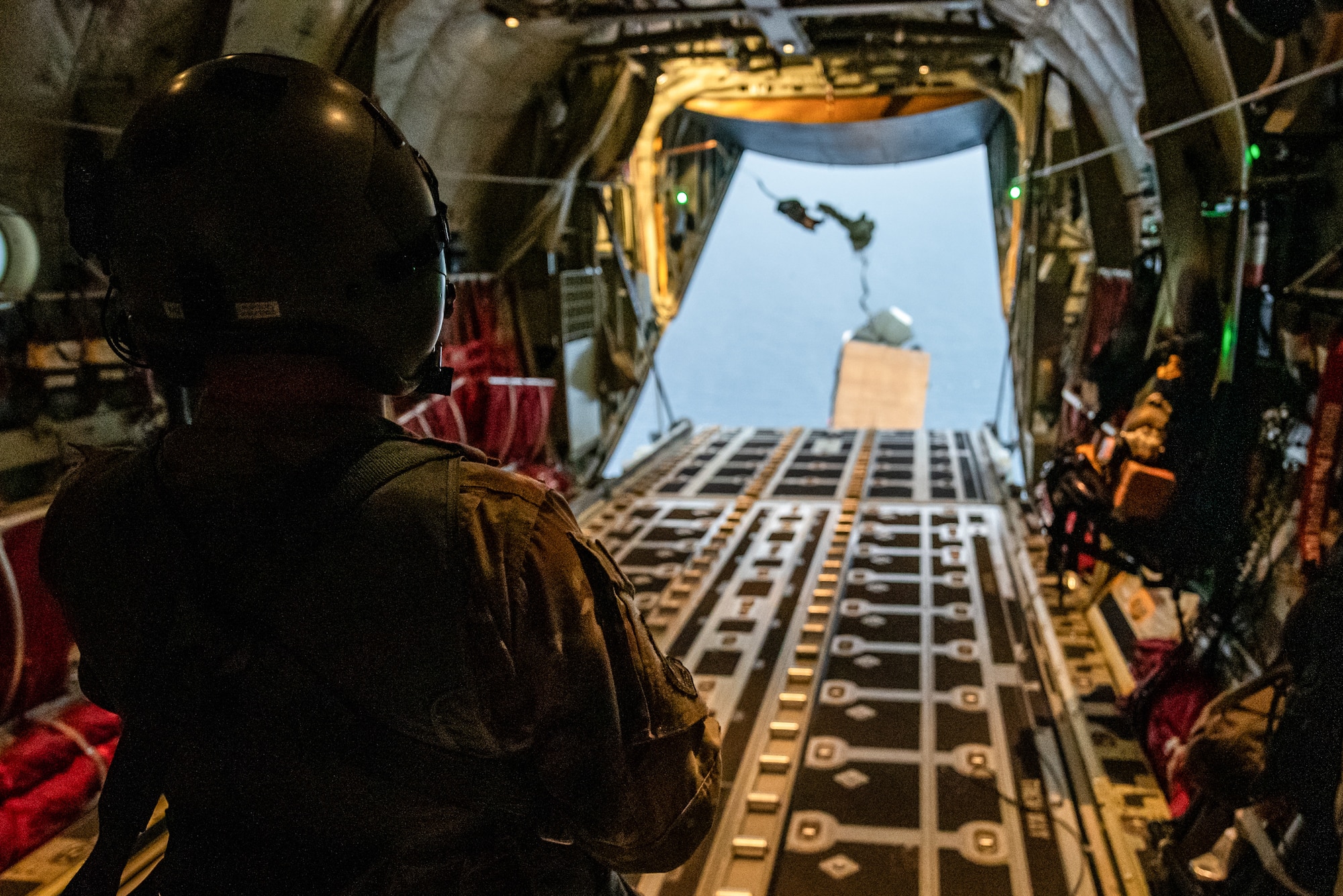 A loadmaster from the Kentucky Air National Guard’s 123rd Airlift Wing supervises as a boat package is deployed into the Caribbean Sea from a C-130J Super Hercules in the skies over St. Croix, U.S. Virgin Islands, Aug. 26, 2025 as part of Emerald Warrior 25.2, a large-scale special operations exercise being staged in multiple locations by Air Force Special Operations Command. St. Croix provides an ideal environment for testing the littoral and maritime capabilities of the wing’s special tactics Airmen, simulating many of the geographic features they may encounter when deployed around the world to project air power in unfamiliar or contested environments. (U.S. Air National Guard photo by Phil Speck)