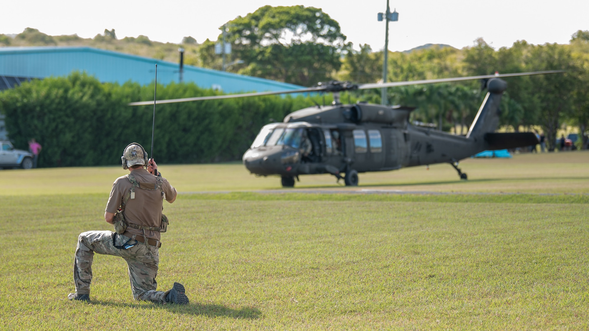 A U.S. Air Force special tactics Airman from the Kentucky Air National Guard’s 123rd Airlift Wing provides landing zone control for Mississippi Army National Guard UH-60 Black Hawk during a mass casualty exercise at the Virgin Islands Air National Guard Station in Christiansted, U.S. Virgin Islands, Aug. 29, 2025 as part of Emerald Warrior 25.2, a large-scale special operations exercise staged in multiple locations by Air Force Special Operations Command. The wing’s pararescuemen provided medical treatment to the victims of a simulated factory explosion before moving them to the Black Hawk for evacuation. (U.S. Air National Guard photo by Phil Speck)
