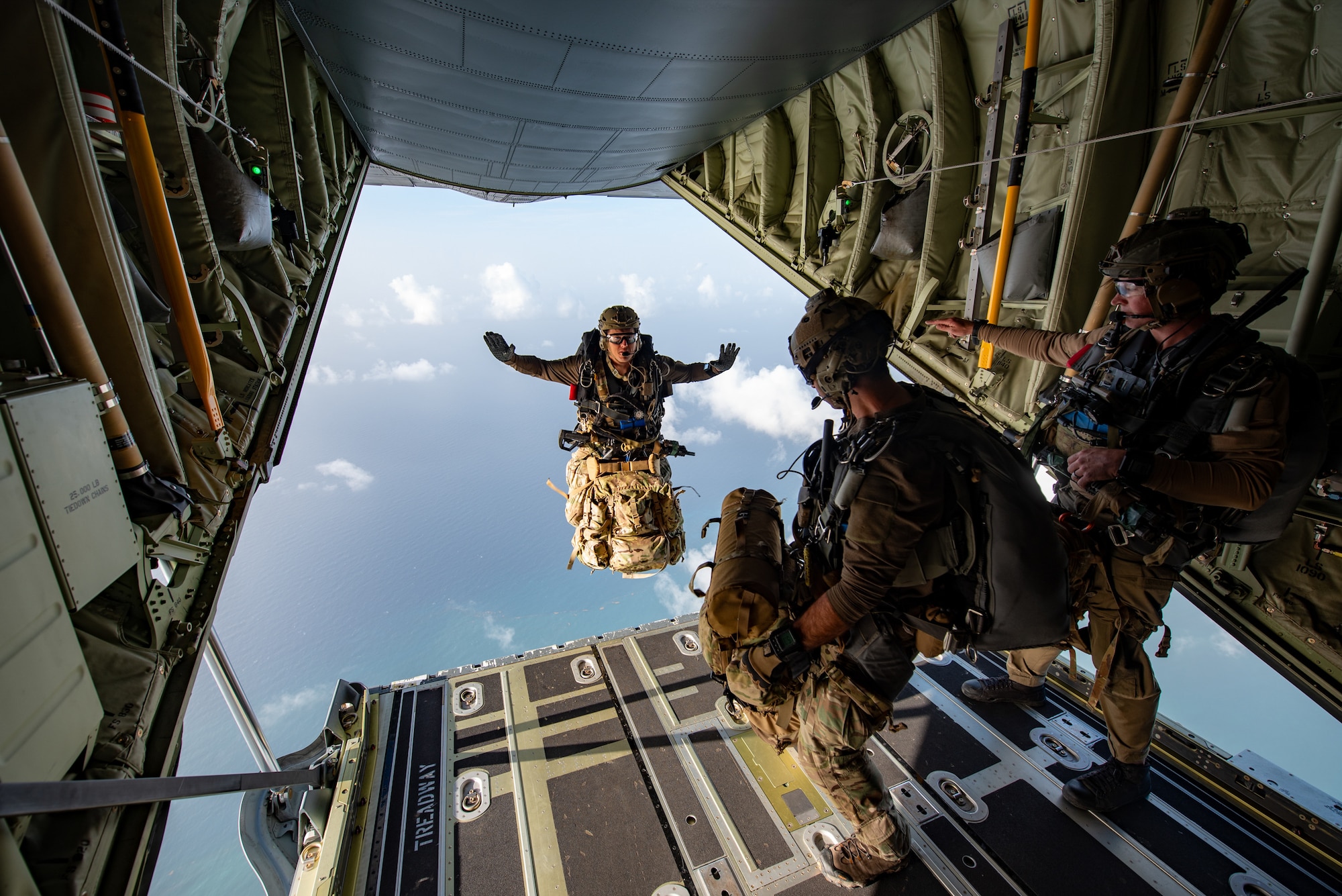 A U.S. Air Force special tactics Airman from the Kentucky Air National Guard’s 123rd Airlift Wing jumps into Henry E. Rohlsen Airport near Christiansted in St. Croix, U.S. Virgin Islands, Aug. 26, 2025 as part of Emerald Warrior 25.2, a large-scale special operations exercise being staged in multiple locations by Air Force Special Operations Command. The Airman, joined by 10 other combat controllers and pararescuemen, took control of the airfield to receive follow-on aircraft in support of simulated combat and contingency operations. (U.S. Air National Guard photo by Phil Speck)