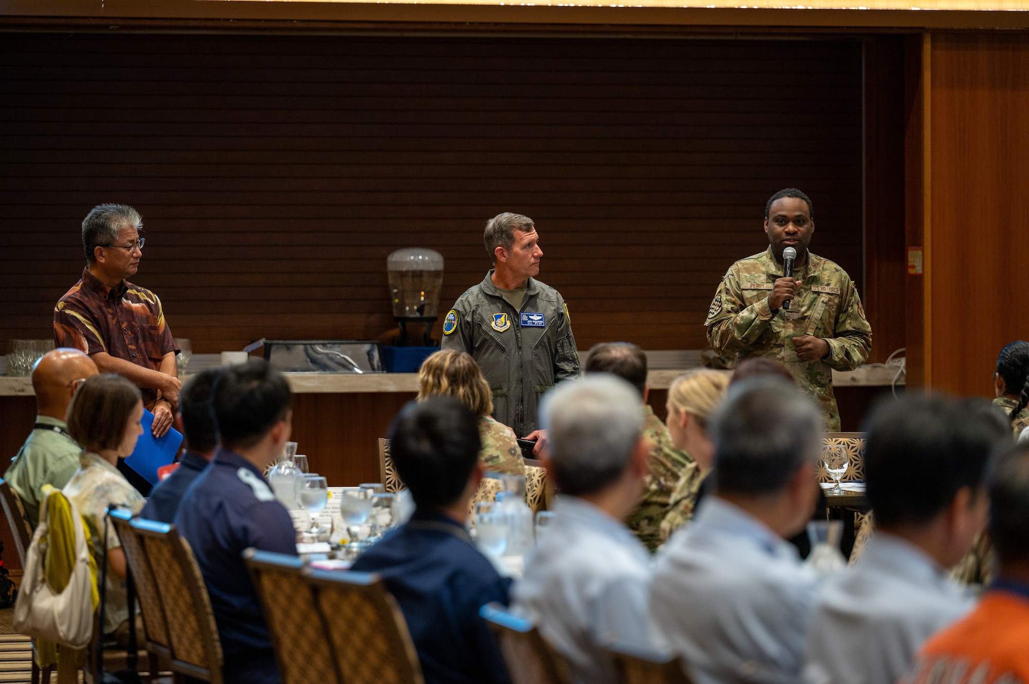 An Airman with the 623rd Air Control Squadron translates for the 18th Wing commander during a bilateral tabletop exercise
