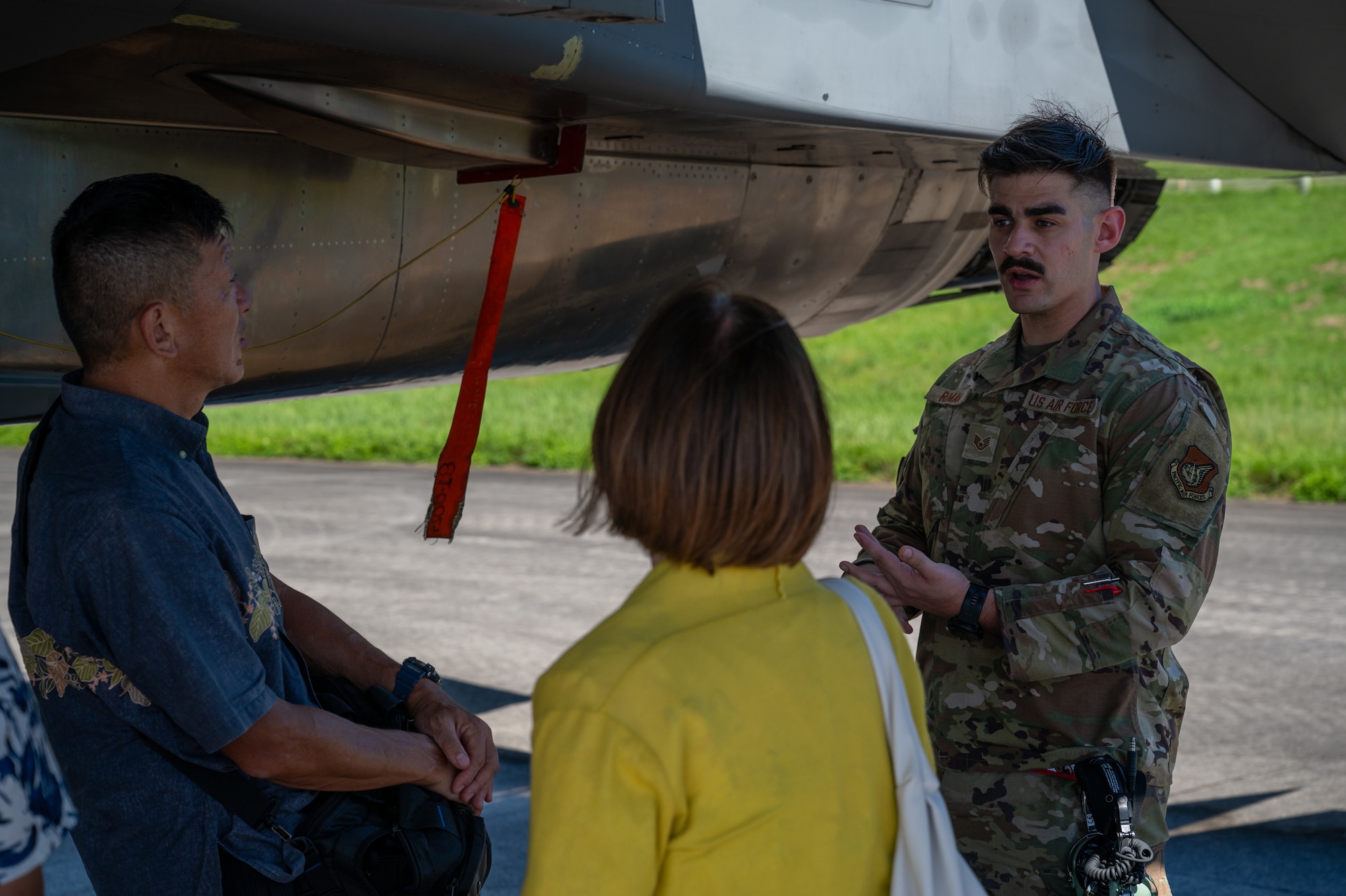 An Airman explaining the F-15C Eagle's capabilities to Government of Japan officials
