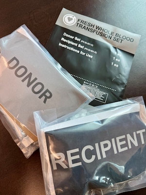GUANTANAMO BAY, Cuba (August 28, 2025) – A fresh whole blood transfusion kit is displayed during training at U.S. Naval Hospital Guantanamo Bay, August 28, 2025. The kit contains supplies for both donor and recipient, enabling rapid blood collection and transfusion in combat or austere environments to support life-saving care and operational readiness. (U.S. Navy photo by Emily McCamy)