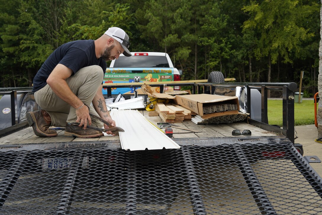 Barren River Lake’s Ryan Weaver prepares supplies to replace the ceiling of a campground restroom that was severely damaged by April’s flooding.
