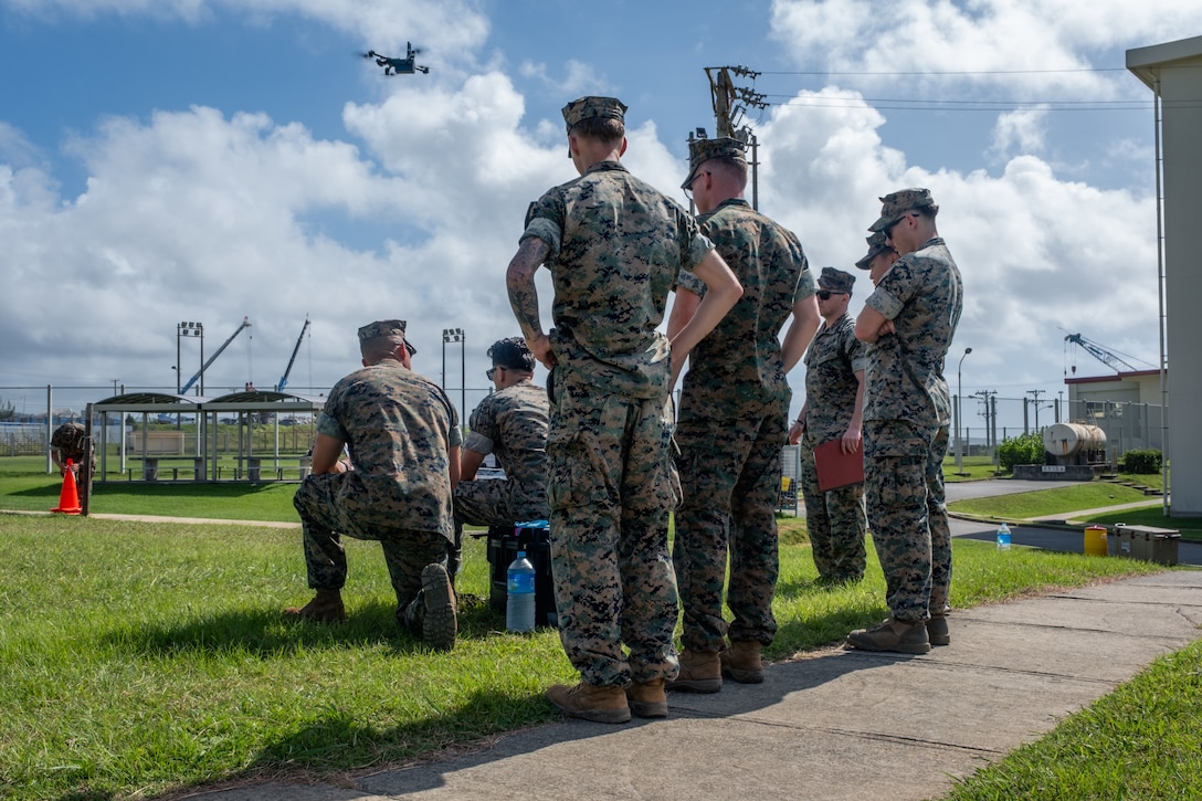 U.S. Marines with 4th Marine Regiment, 3d Marine Division operate an untethered Skydio X2D small unmanned aircraft system on Camp Schwab, Okinawa, Japan, Aug. 12, 2025. This class, which certifies Marines to fly multiple variants of sUAS, was the first time untethered drones were flown over a military installation on Okinawa under the Secretary of Defense's new guidance, which seeks to expand the use of small, American-made drones to enhance military capabilities. (U.S. Marine Corps photo by Cpl. Joaquin Dela Torre)