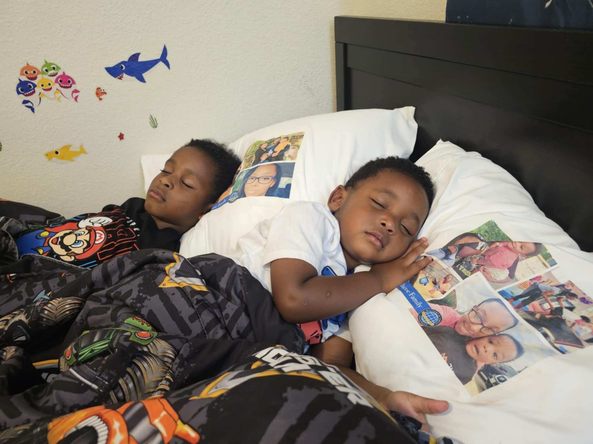 Two children lay in bed.
