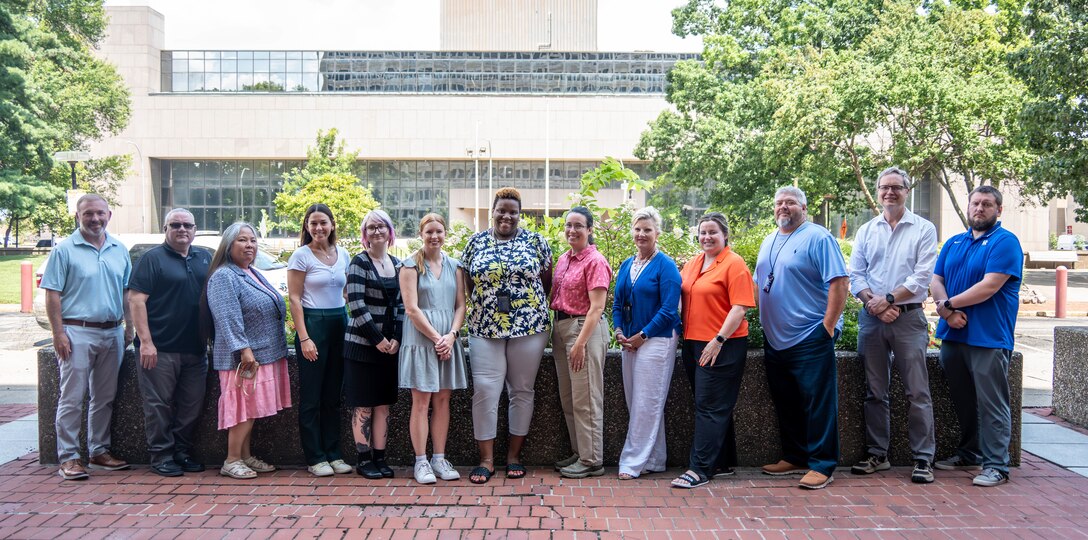 Team members of the Real Estate Division Inleasing Branch gather in front of the federal building in Downtown Louisville, Kentucky, Aug. 20, 2025.