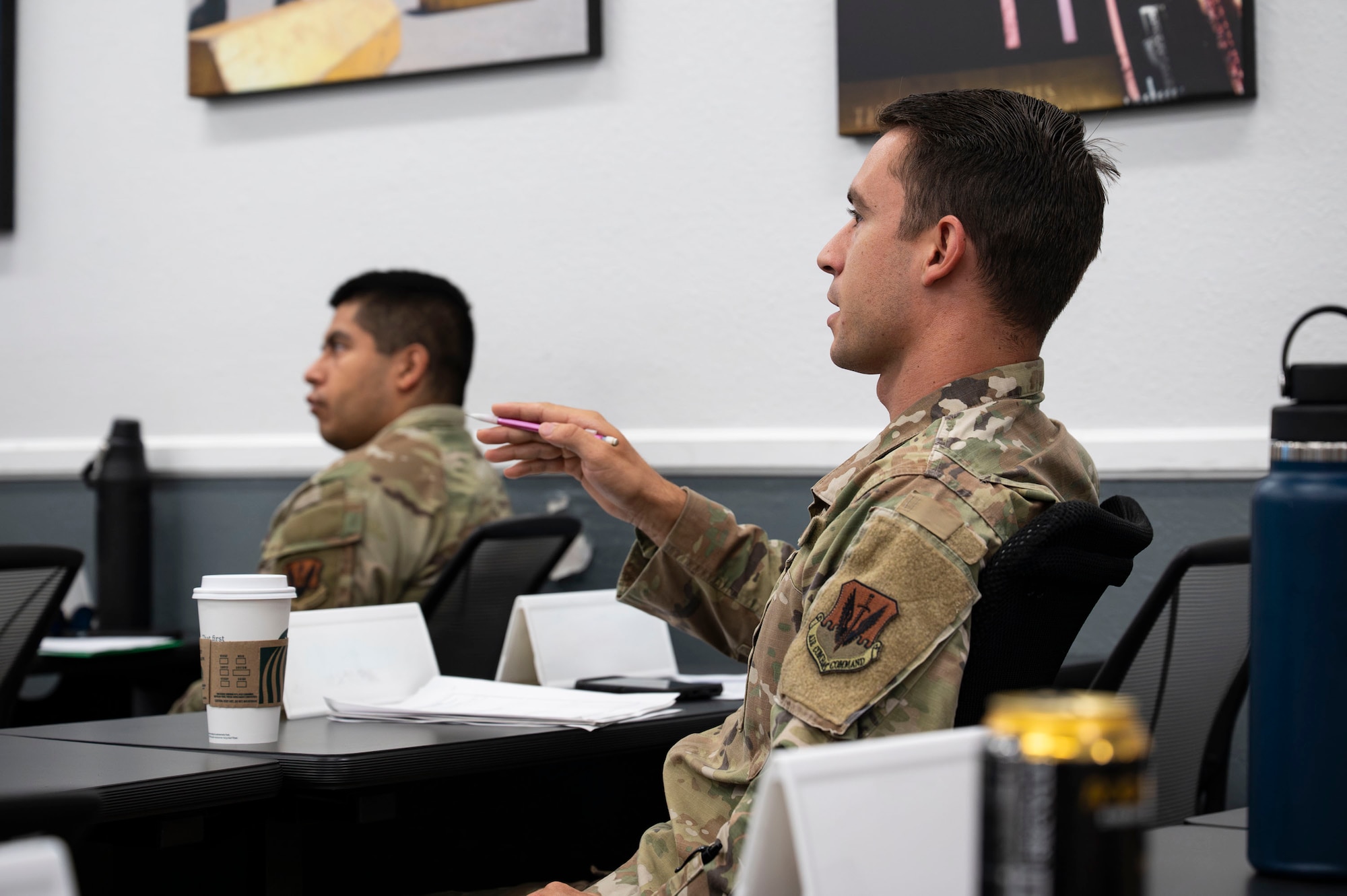 A U.S. Airman asks a question during the Junior Enlisted Foundations 300 Course at Davis-Monthan Air Force Base, Arizona, Sept. 3, 2025. The course fosters professional growth, giving Airmen the tools to succeed in both current and future roles. (U.S. Air Force photo by Airman 1st Class Samantha Melecio)