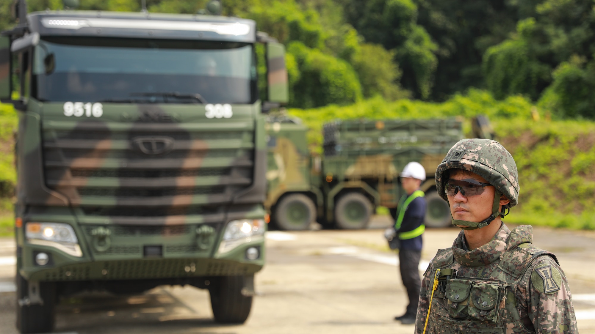 Man stands near truck.