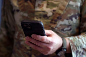A technical sergeant simulates a phone conversation Sept. 4, 2025, at the Russell Knox Building in Quantico, Virginia.