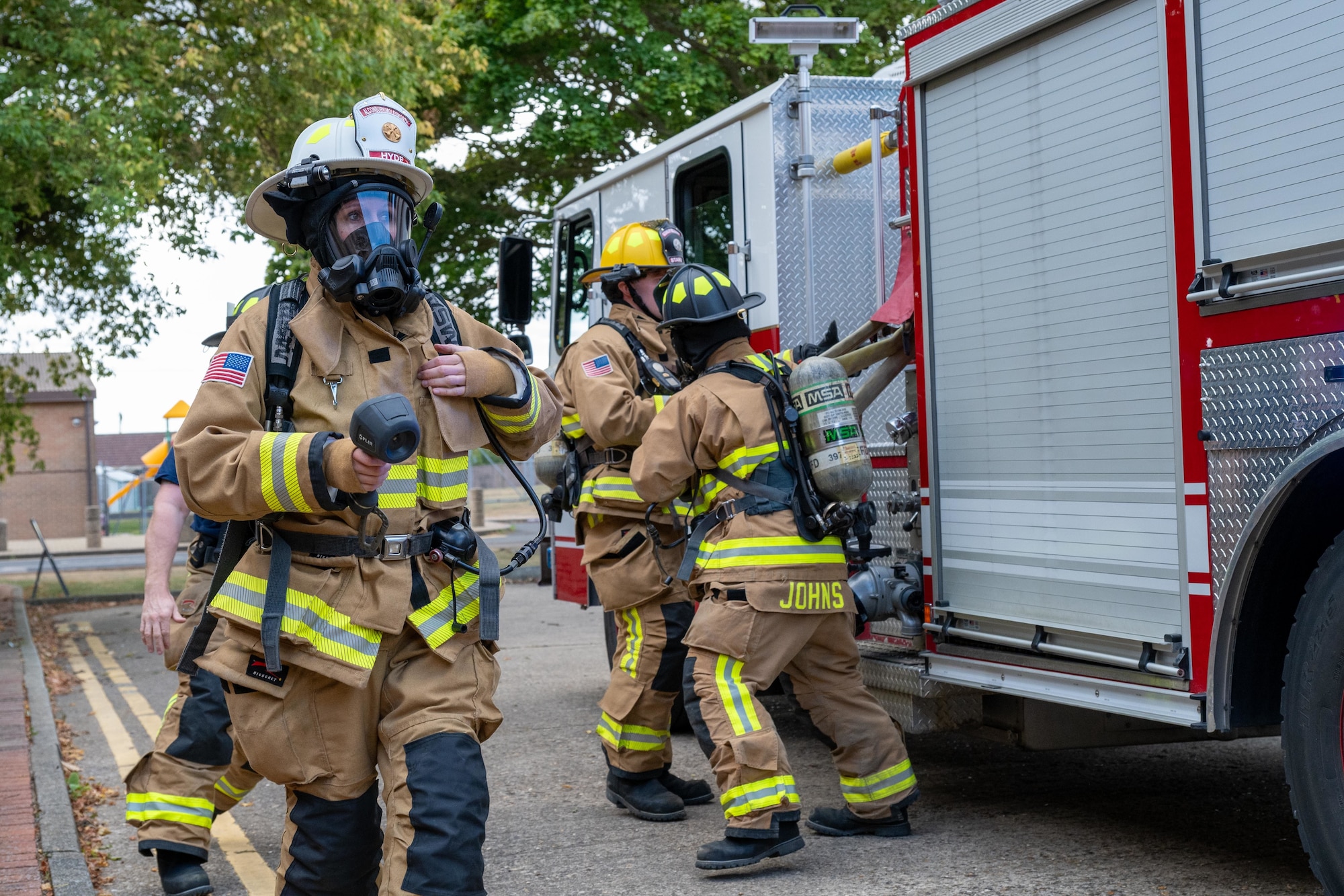 Firefighters prepare equipment during a joint emergency response