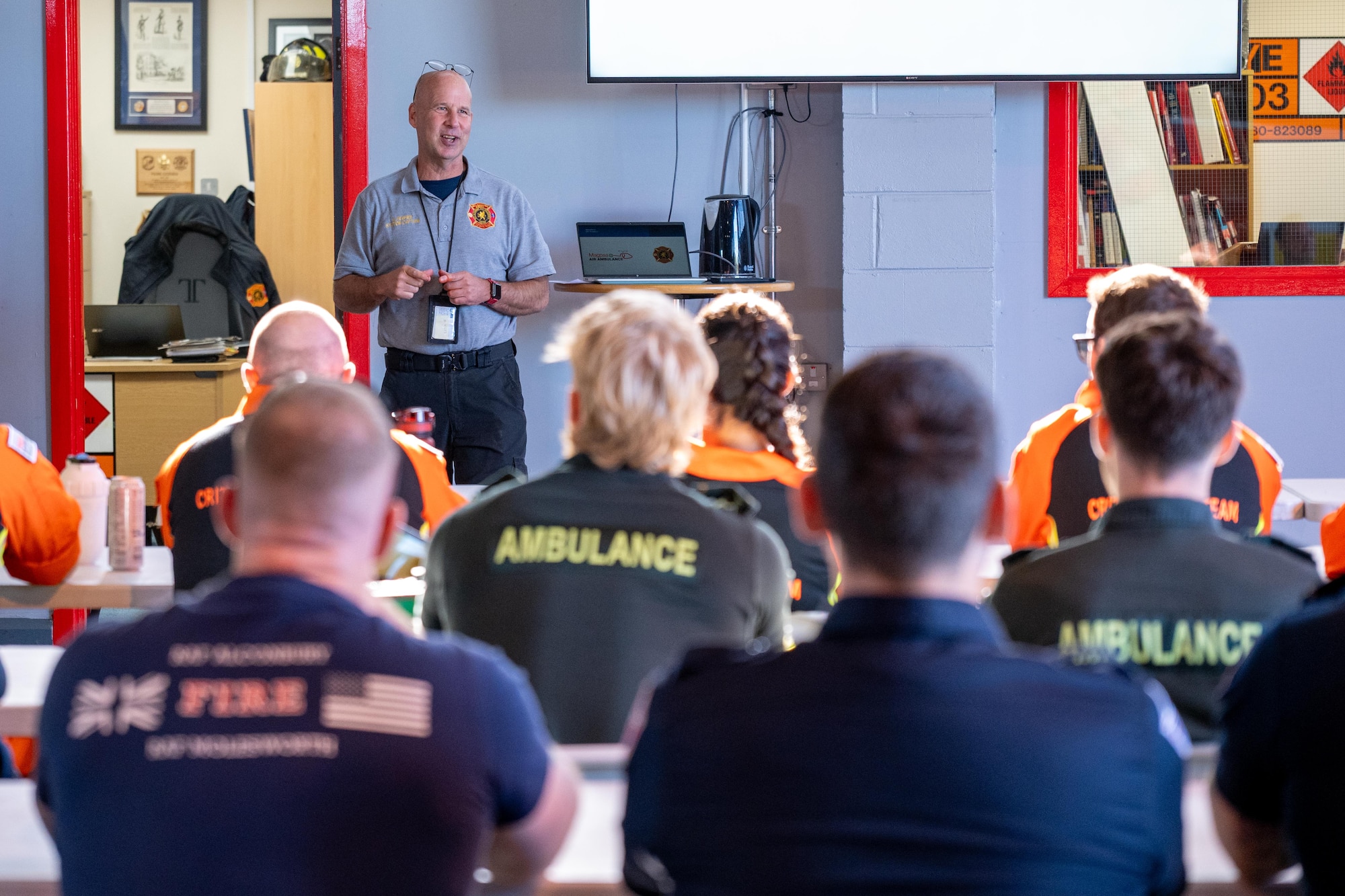 Firefighters and UK paramedics receive a briefing