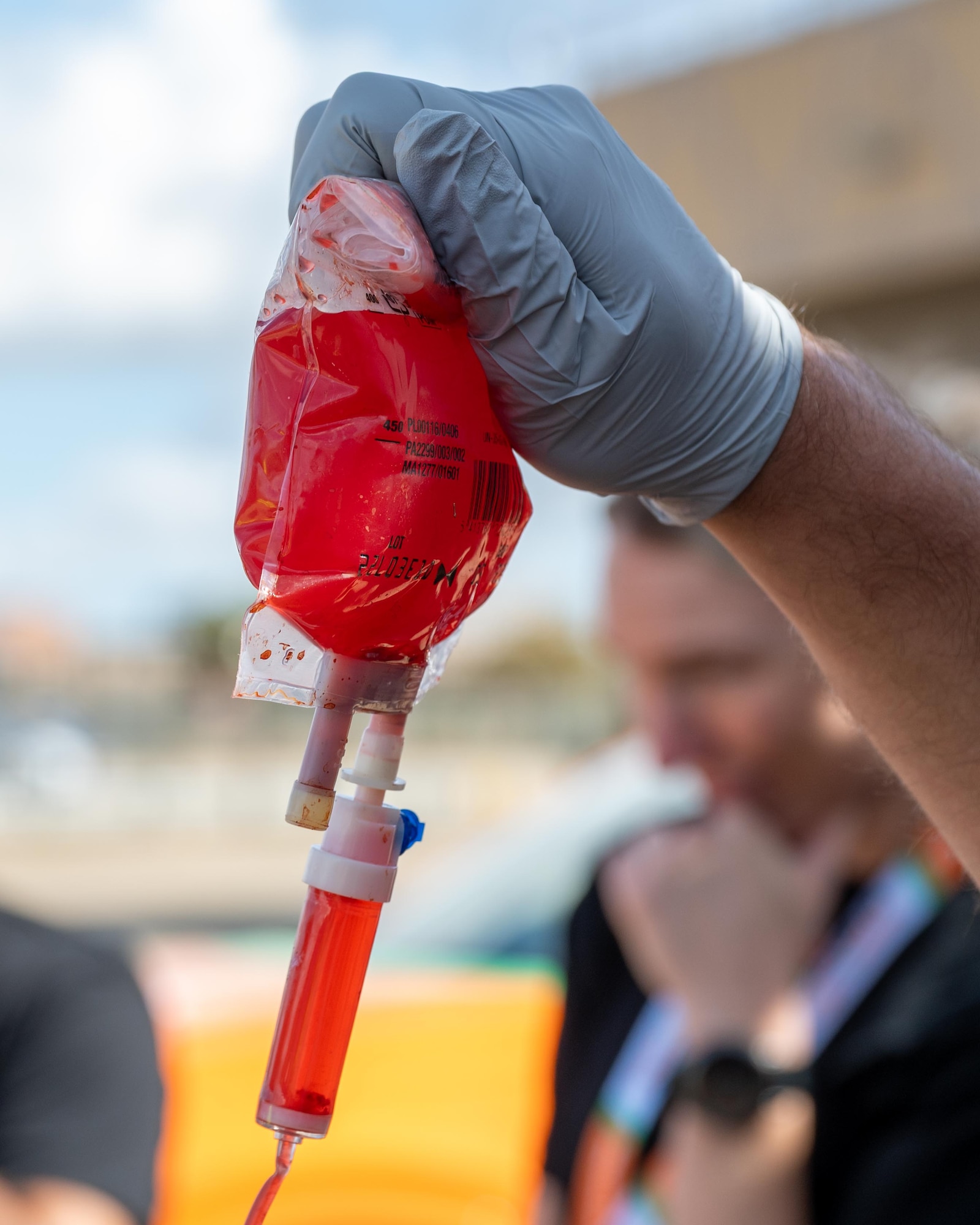 A bag of simulated blood is used during a joint training exercise
