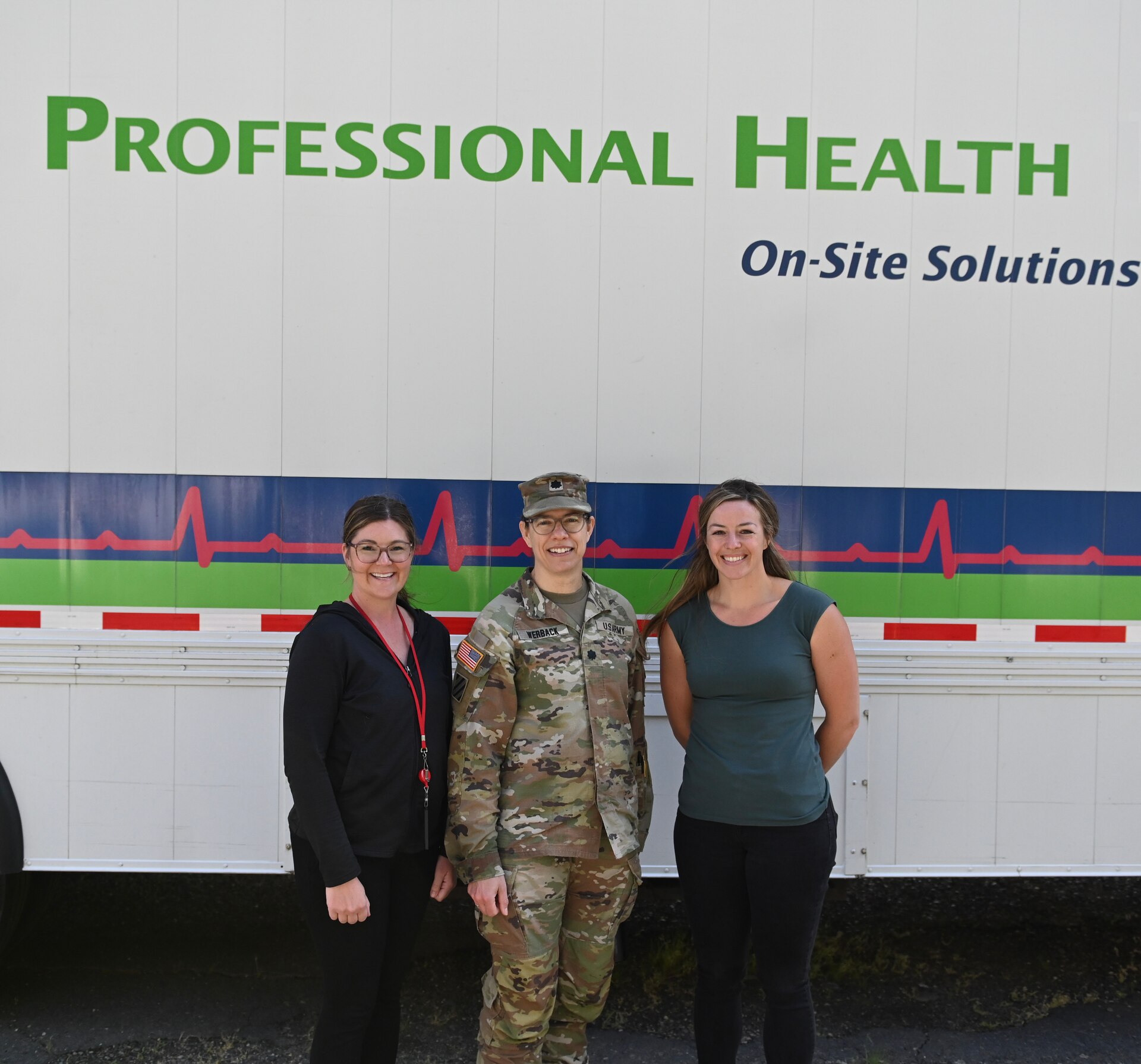 (Left to Right) Ashley Armes, Administrative Services Assistant, 
LTC Kathyrn Werback, Walla Walla District Commander, with Hannah Boudreaux, Safety and Occupational Health Nurse and Program Manager, outside the mobile health clinic at Lower Granite Lock and Dam.