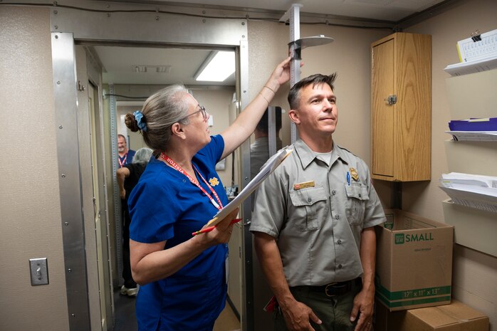 Walla Walla District Park Ranger Seth Langianese undergoes an examination at the mobile health clinic.