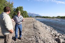 Kenny Koebberling (right), project manager, Walla Walla District, U.S. Army Corps of Engineers, discusses Jackson Levees rehabilitation efforts with Chris Silbernagel, the operating program manager for Lucky Peak Dam near Boise, Idaho, Aug. 21, 2025, stressing the significance of teamwork in the Walla Walla District's long-term success. More than 10,000 residents, along with homes, businesses, emergency facilities and farmland, are protected annually due to ongoing rehabilitation efforts on the Jackson Levees.
