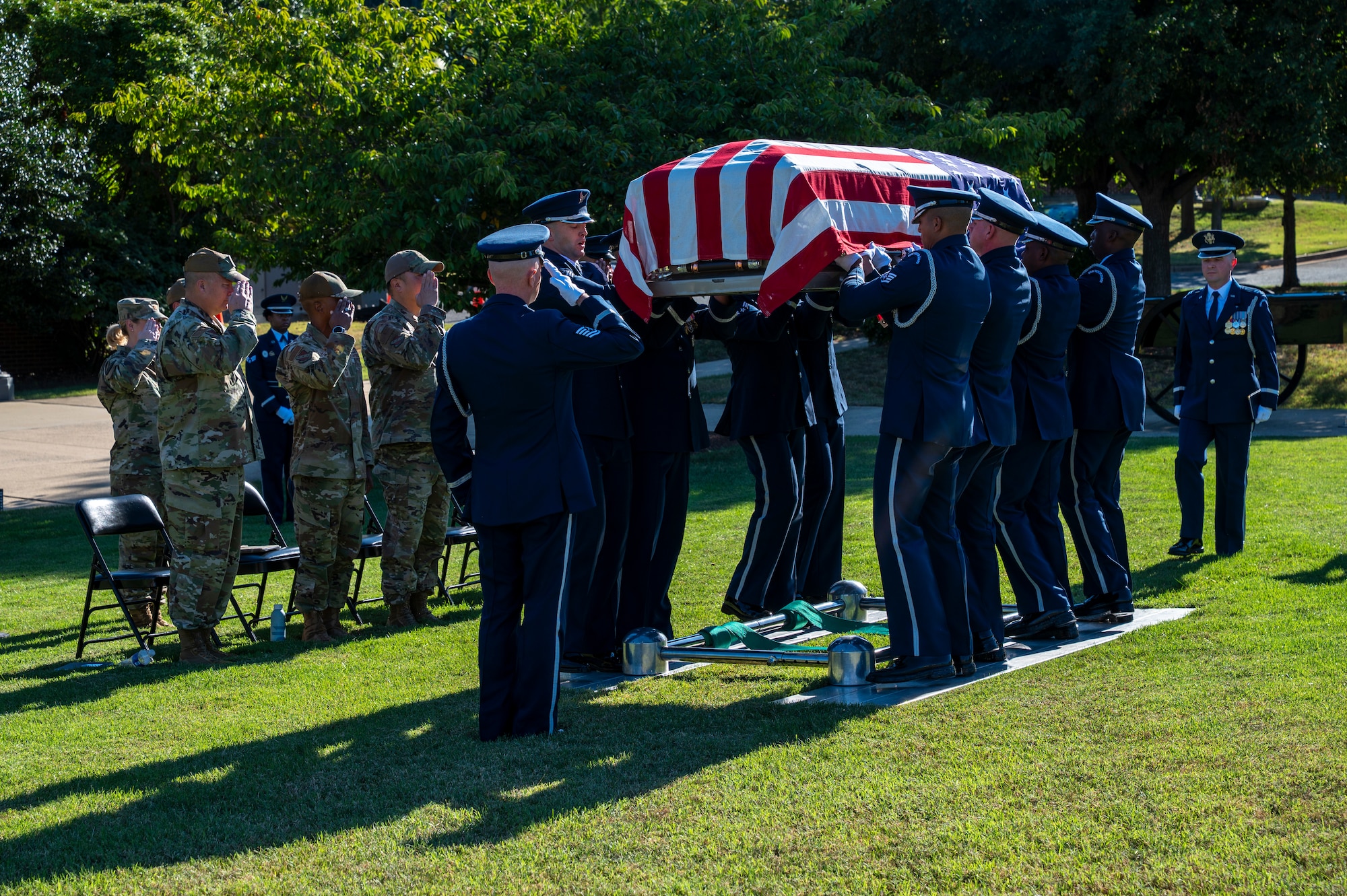 U.S. Air Force Honor Guard Pallbearers lower a casket during a funeral demonstration to attendees of an immersion tour at Joint Base Anacostia-Bolling, Washington, D.C., Aug. 26, 2025. The tour gave new JBAB and Air Force District of Washington leadership firsthand insight on the operations of Pallbearers which are a necessary component of any funeral. (U.S. Air Force photo by Hayden Hallman)