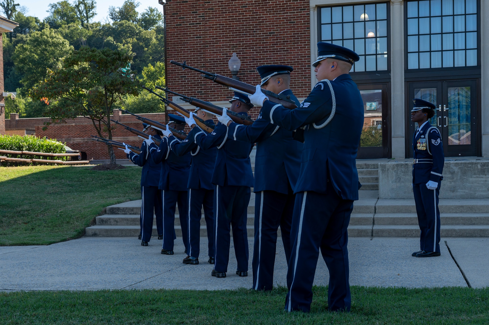 The U.S. Air Force Honor Guard Firing Party conducts a three-volley salute during a funeral demonstration to attendees of an immersion tour at Joint Base Anacostia-Bolling, Washington, D.C., Aug. 26, 2025. The tour gave new JBAB and Air Force District of Washington leadership firsthand insight on the operations of the Honor Guard whose mission is to deliver premier ceremonial honors, inspire the nation, and represent all Airmen and Guardians to the world. (U.S. Air Force photo by Hayden Hallman)