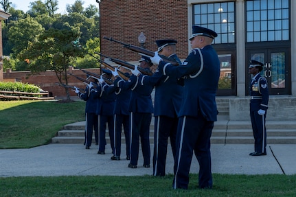The U.S. Air Force Honor Guard Firing Party conducts a three-volley salute during a funeral demonstration to attendees of an immersion tour at Joint Base Anacostia-Bolling, Washington, D.C., Aug. 26, 2025. The tour gave new JBAB and Air Force District of Washington leadership firsthand insight on the operations of the Honor Guard whose mission is to deliver premier ceremonial honors, inspire the nation, and represent all Airmen and Guardians to the world. (U.S. Air Force photo by Hayden Hallman)