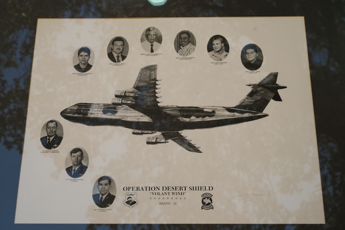 A memorial photo collage shows the portraits of the nine 433rd Military Airlift Wing Airmen who lost their lives during the BRAVO-12 crash Aug. 29, 1990.