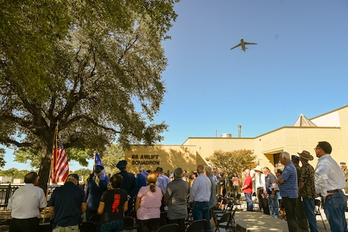 A 433rd Airlift Wing C-5M Super Galaxy passes over during a remembrance ceremony outside the 68th Airlift Squadron building on Joint Base San Antonio-Lackland, Texas Aug. 29, 2025.