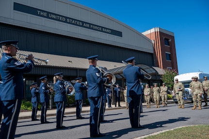 Members of The U.S. Air Force Band perform for attendees during an immersion tour at Joint Base Anacostia-Bolling, Washington, D.C., Aug. 26, 2025. The tour gave new JBAB and Air Force District of Washington leadership firsthand insight on the operations of The Band which is to honor those who have served, inspire American citizens to heightened patriotism and service, and connect with the global community on behalf of the U.S. Air Force and the United States of America. (U.S. Air Force photo by Hayden Hallman)