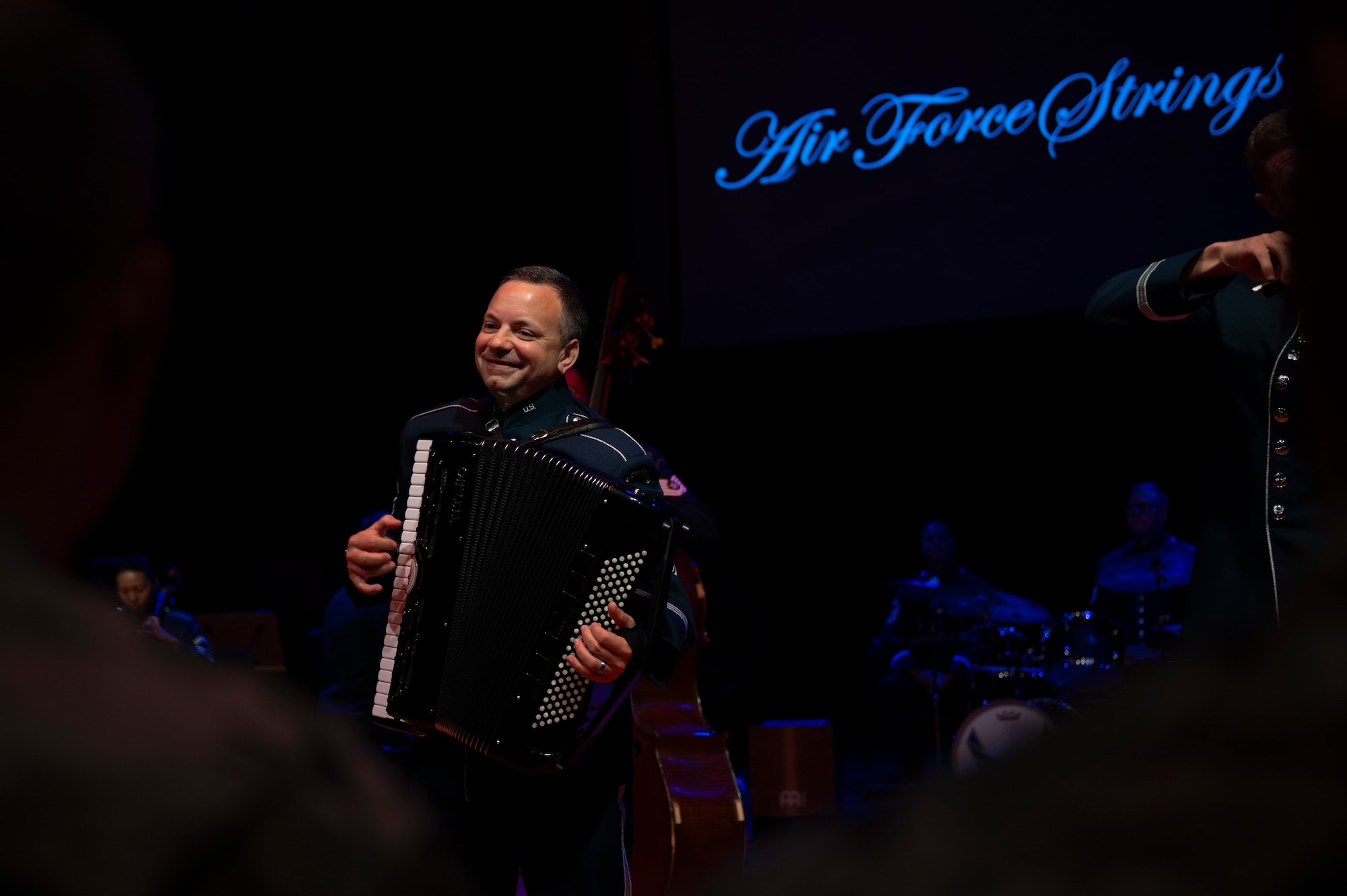 U.S. Air Force Senior Master Sgt. Frank J. Busso Jr., the accordionist with the U.S. Air Force Band’s Air Force Strings, performs for attendees of an immersion tour at Joint Base Anacostia-Bolling, Washington, D.C., Aug. 26, 2025. The tour gave new JBAB and Air Force District of Washington leadership firsthand insight on the operations of the Air Force Strings which appear regularly at military and civilian ceremonial functions, education outreach events, and concerts in the metropolitan Washington, D.C. area. (U.S. Air Force photo by Hayden Hallman)