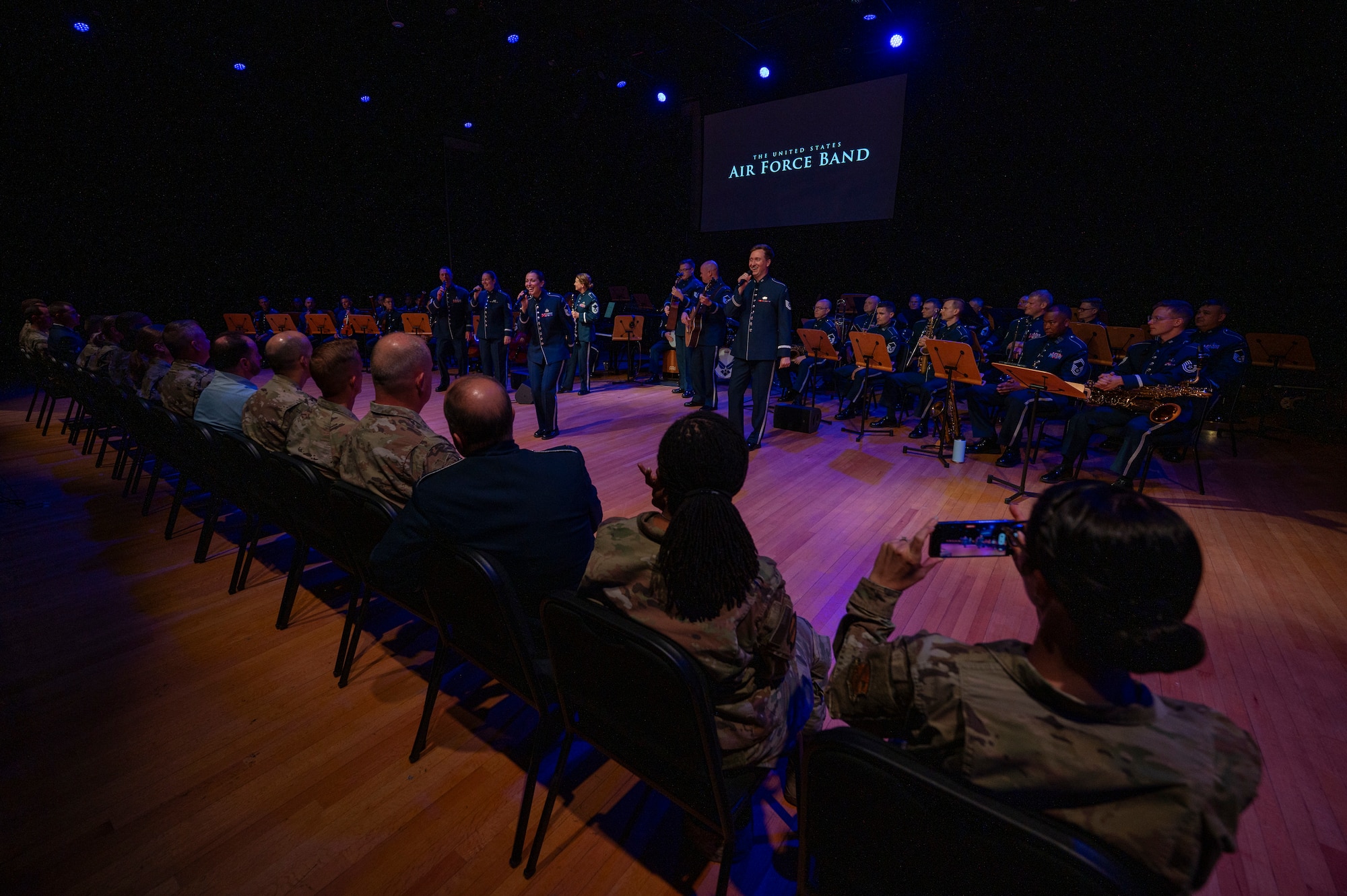 Members of The U.S. Air Force Band’s Singing Sergeants perform for attendees of an immersion tour at Joint Base Anacostia-Bolling, Washington, D.C., Aug. 26, 2025. The tour gave new JBAB and Air Force District of Washington leadership firsthand insight on the operations of the Singing Sergeants which supports ceremonial and diplomatic functions, educational outreach events, and perform concerts throughout Washington, D.C. and the United States. (U.S. Air Force photo by Hayden Hallman)