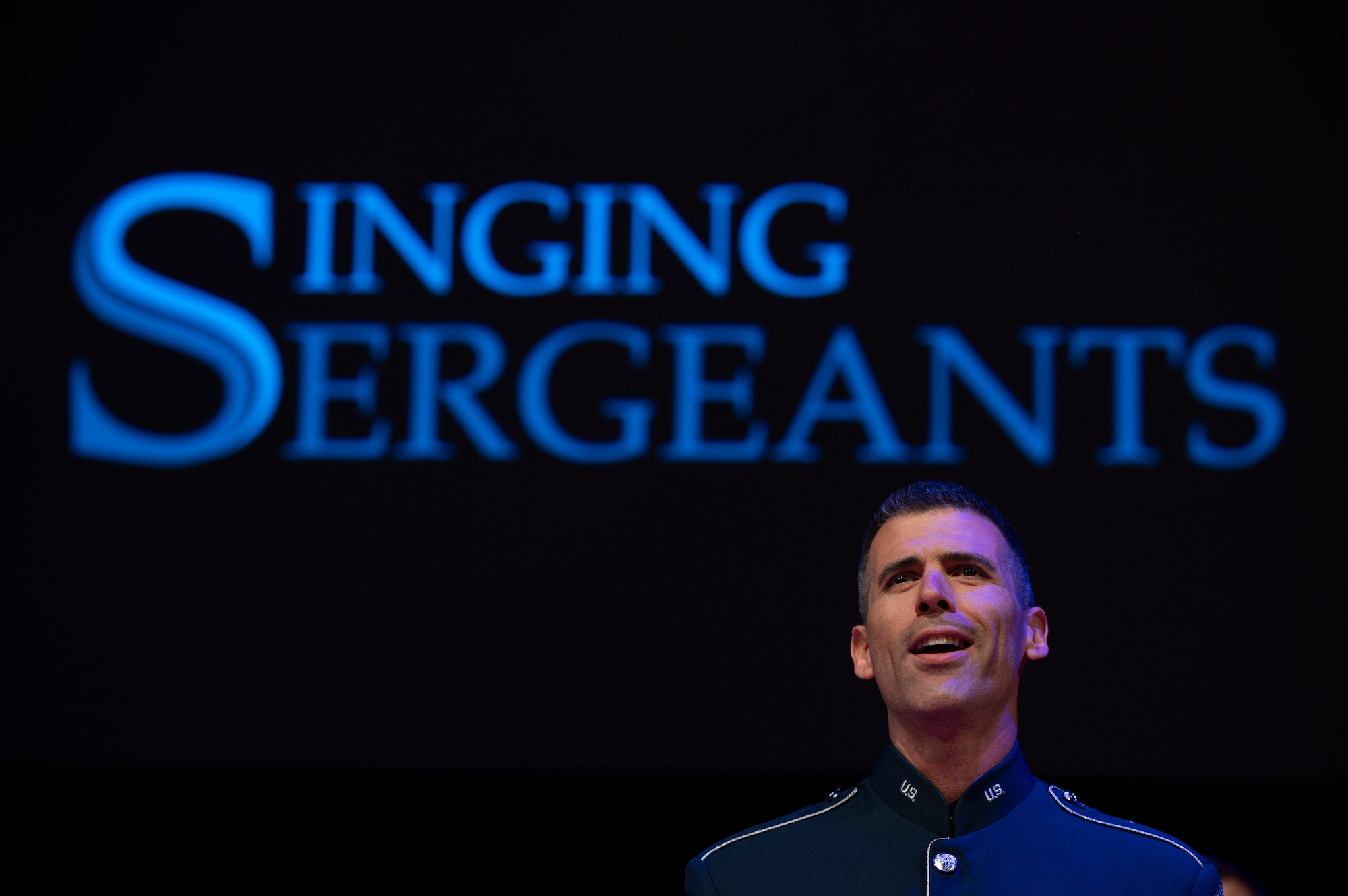 U.S. Air Force Tech. Sgt. Michael Aiello, a baritone vocalist with The U.S. Air Force Band’s Singing Sergeants performs a vocal solo for attendees during an immersion tour at Joint Base Anacostia-Bolling, Washington, D.C., Aug. 26, 2025. The tour gave new JBAB and Air Force District of Washington leadership firsthand insight on the operations of the Singing Sergeants which supports ceremonial and diplomatic functions, educational outreach events, and perform concerts throughout Washington, D.C. and the United States. (U.S. Air Force photo by Hayden Hallman)
