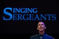 U.S. Air Force Tech. Sgt. Michael Aiello, a baritone vocalist with The U.S. Air Force Band’s Singing Sergeants performs a vocal solo for attendees during an immersion tour at Joint Base Anacostia-Bolling, Washington, D.C., Aug. 26, 2025. The tour gave new JBAB and Air Force District of Washington leadership firsthand insight on the operations of the Singing Sergeants which supports ceremonial and diplomatic functions, educational outreach events, and perform concerts throughout Washington, D.C. and the United States. (U.S. Air Force photo by Hayden Hallman)