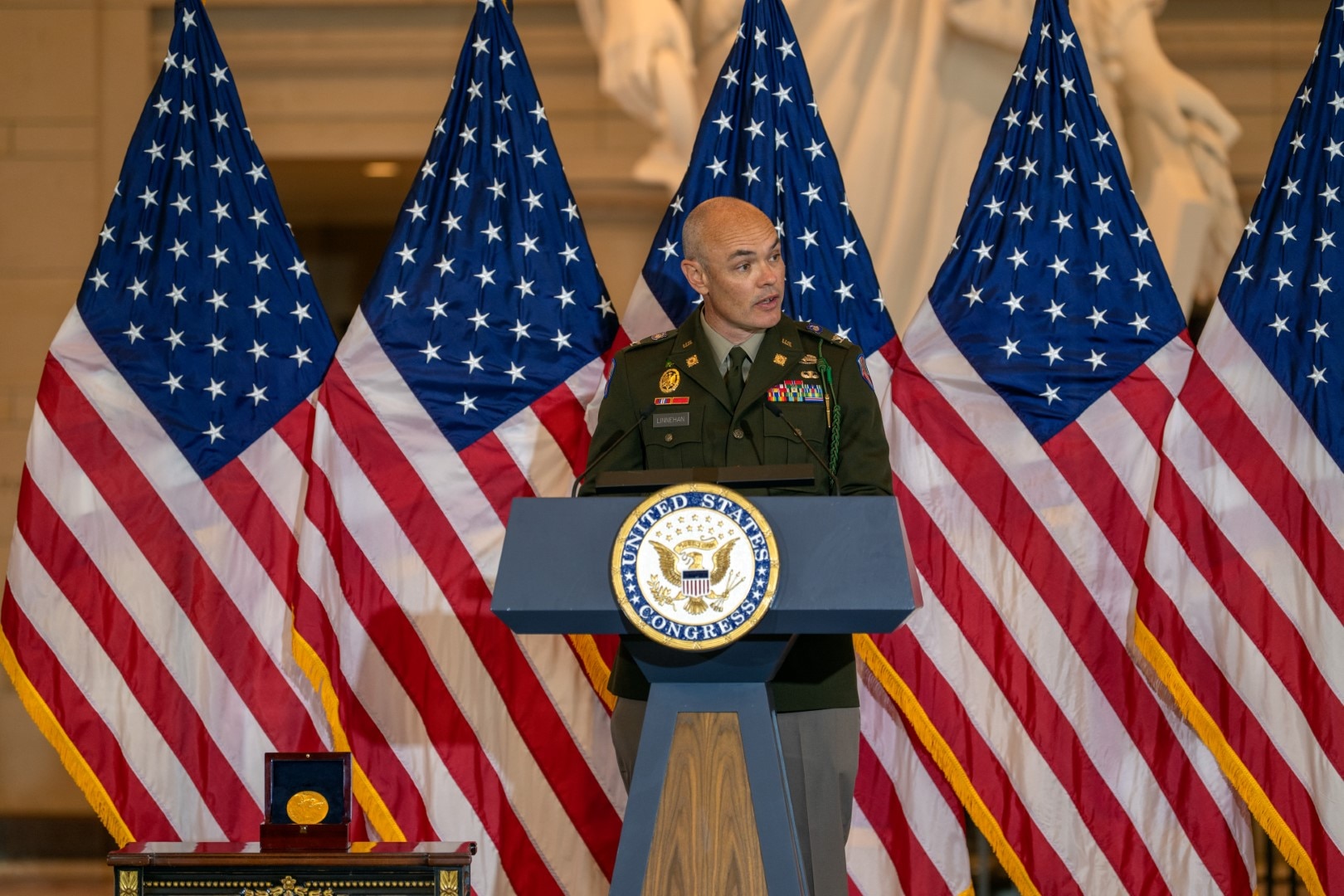 U.S. Army Col. Bryon Linnehan, Commander of the 369th Sustainment Brigade, New York Army National Guard, addresses the audience during a Congressional Gold Medal award ceremony for the Army’s World War I 369th Infantry Regiment, the “Harlem Hellfighters,” in Emancipation Hall at the U.S. Capitol, September 3, 2025, in Washington.