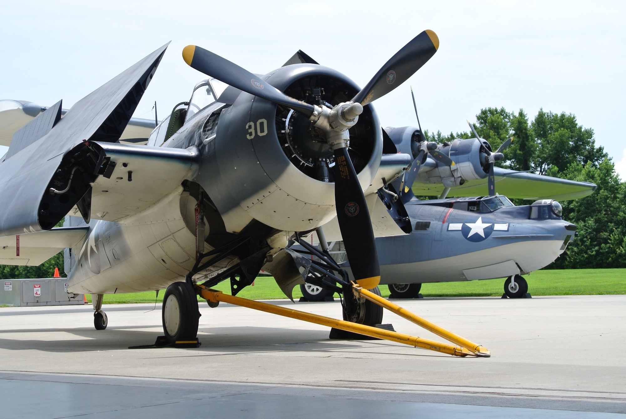 A Grumman FM-2 Wildcat (foreground) and a Consolidated Catalina PBY-5A (rear) on display at the Military Aviation Museum in Virginia Beach, Virginia.