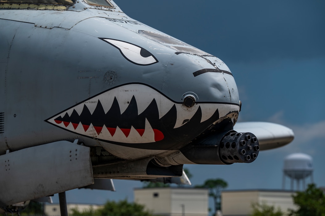 A military airplane stands on an airfield.