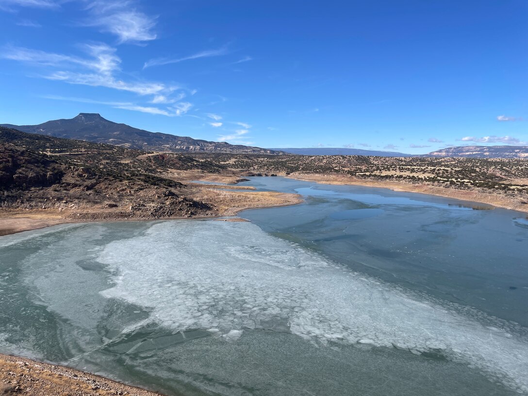 Ice pushes up against the toe of Abiquiu Dam, N.M., Feb. 8, 2025. Photo by Pamela Bowie.